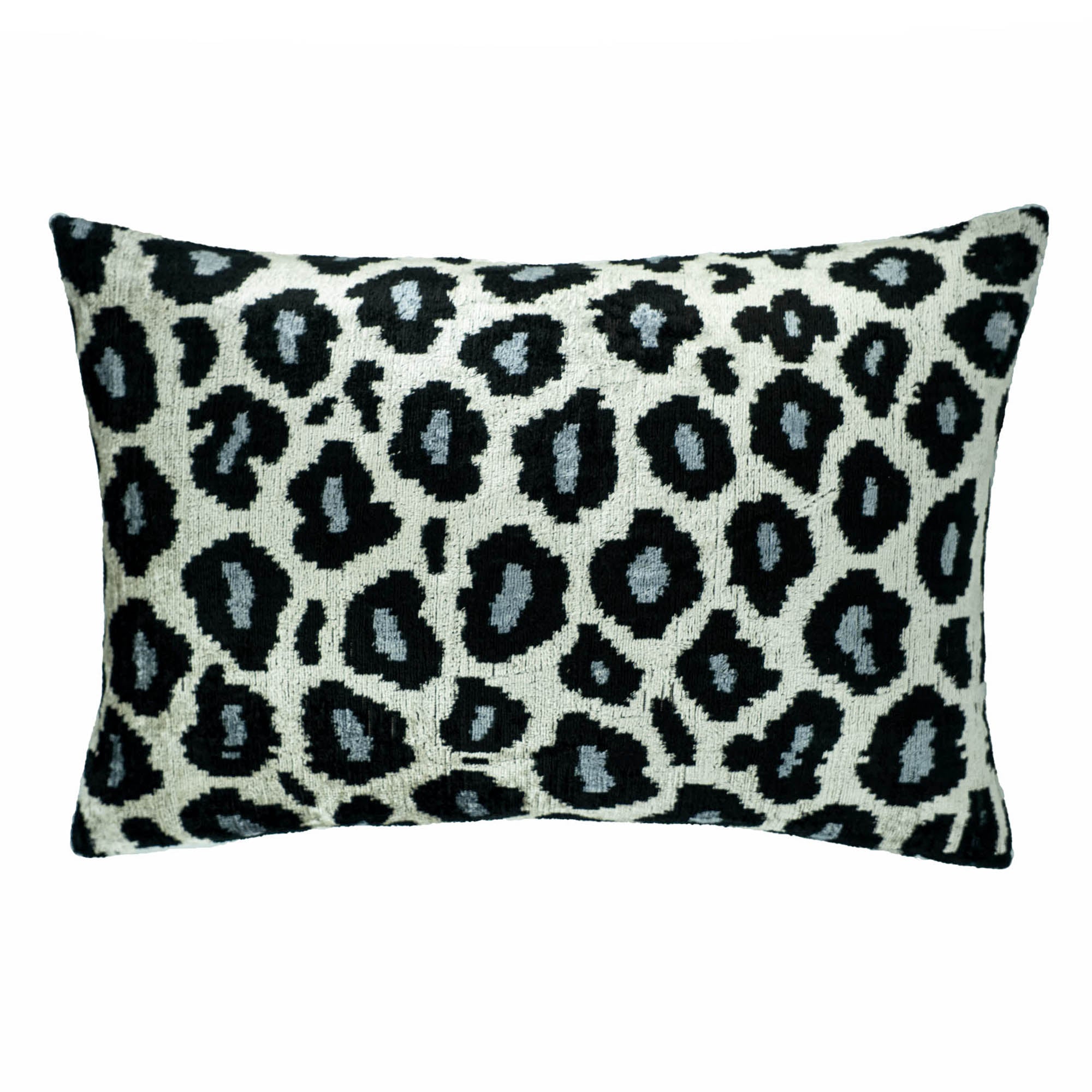 Chouchou Touch silk velvet pillow cover with a modern twist on traditional Ikat weaving and animal patterns.