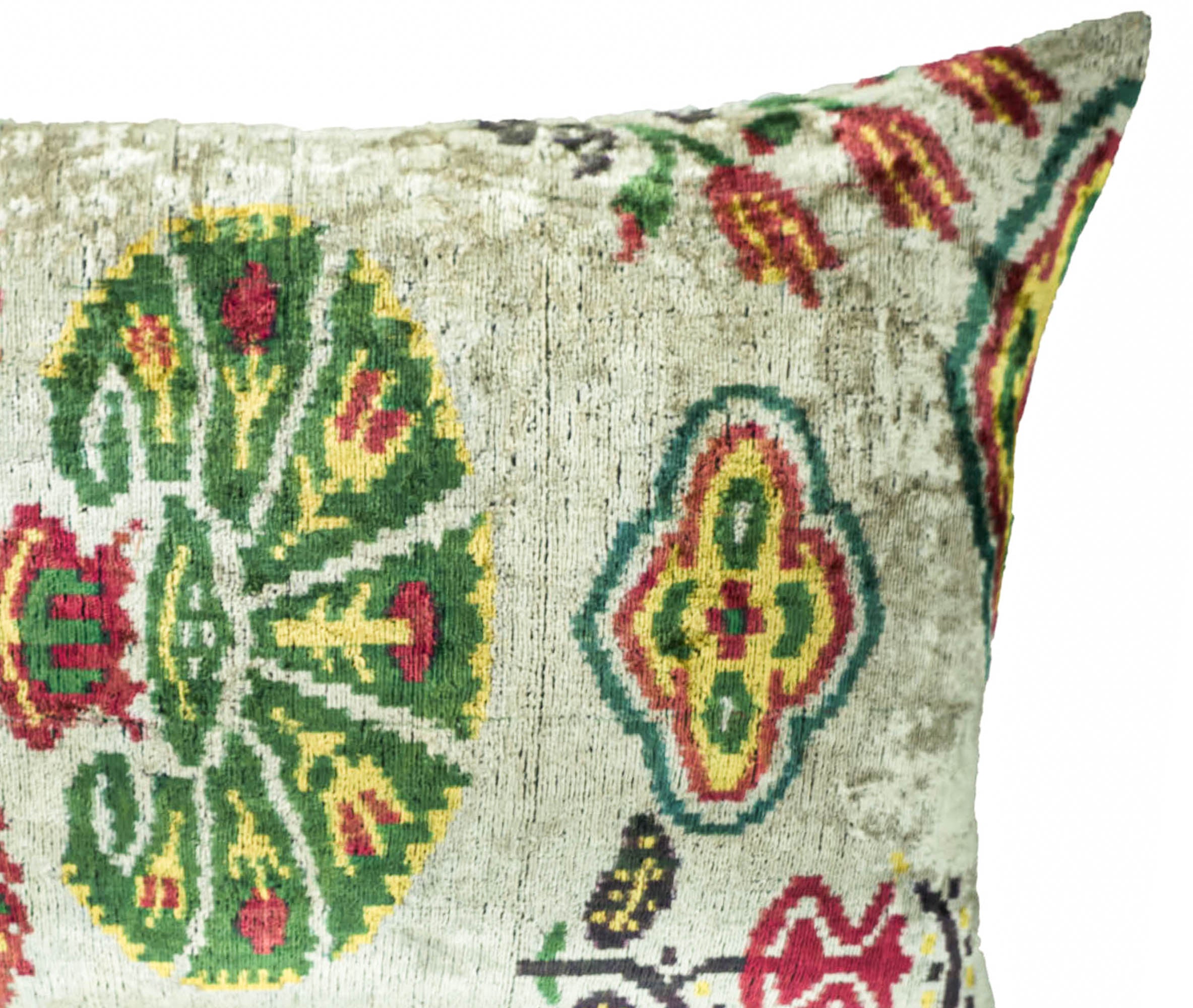 Chouchou Touch silk velvet pillow with colorful carnation motifs, perfect for creating a statement home decor accent.