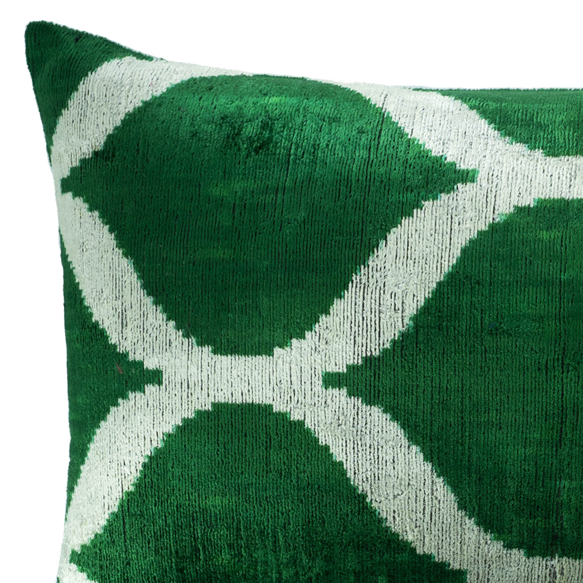 Elegant green and white silk velvet pillow cover inspired by traditional Ikat weaving techniques.