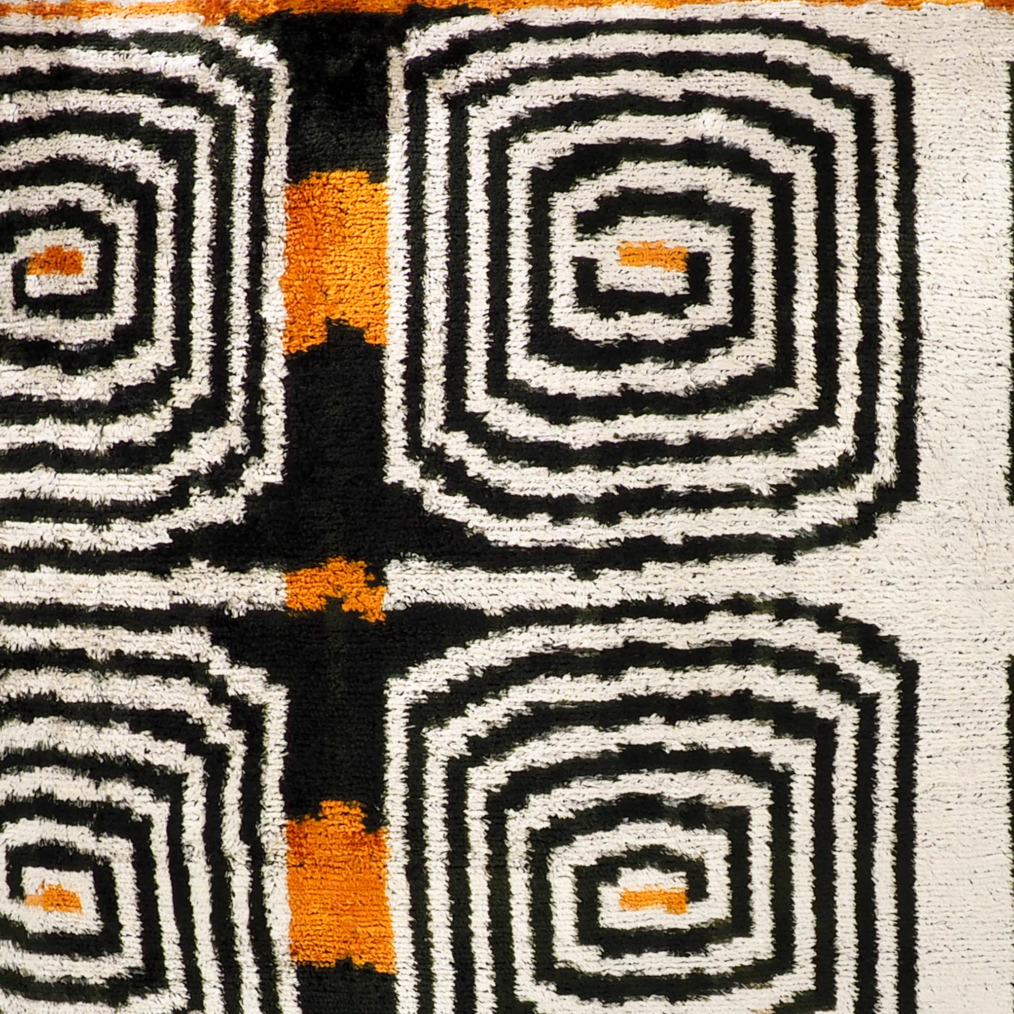 Traditional Ikat silk velvet pillow cover with labyrinth-inspired designs, perfect for creating a statement piece.
