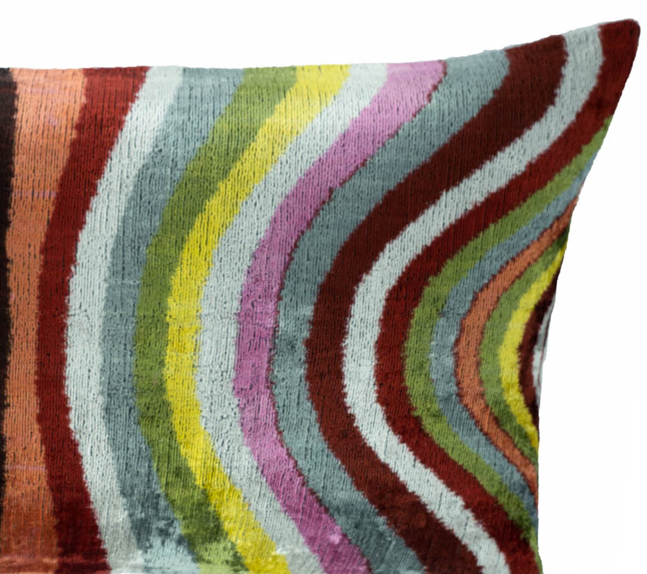 Pauli silk velvet throw pillow by Chouchou Touch, showcasing multicolor Ikat weaving in dynamic wave patterns.
