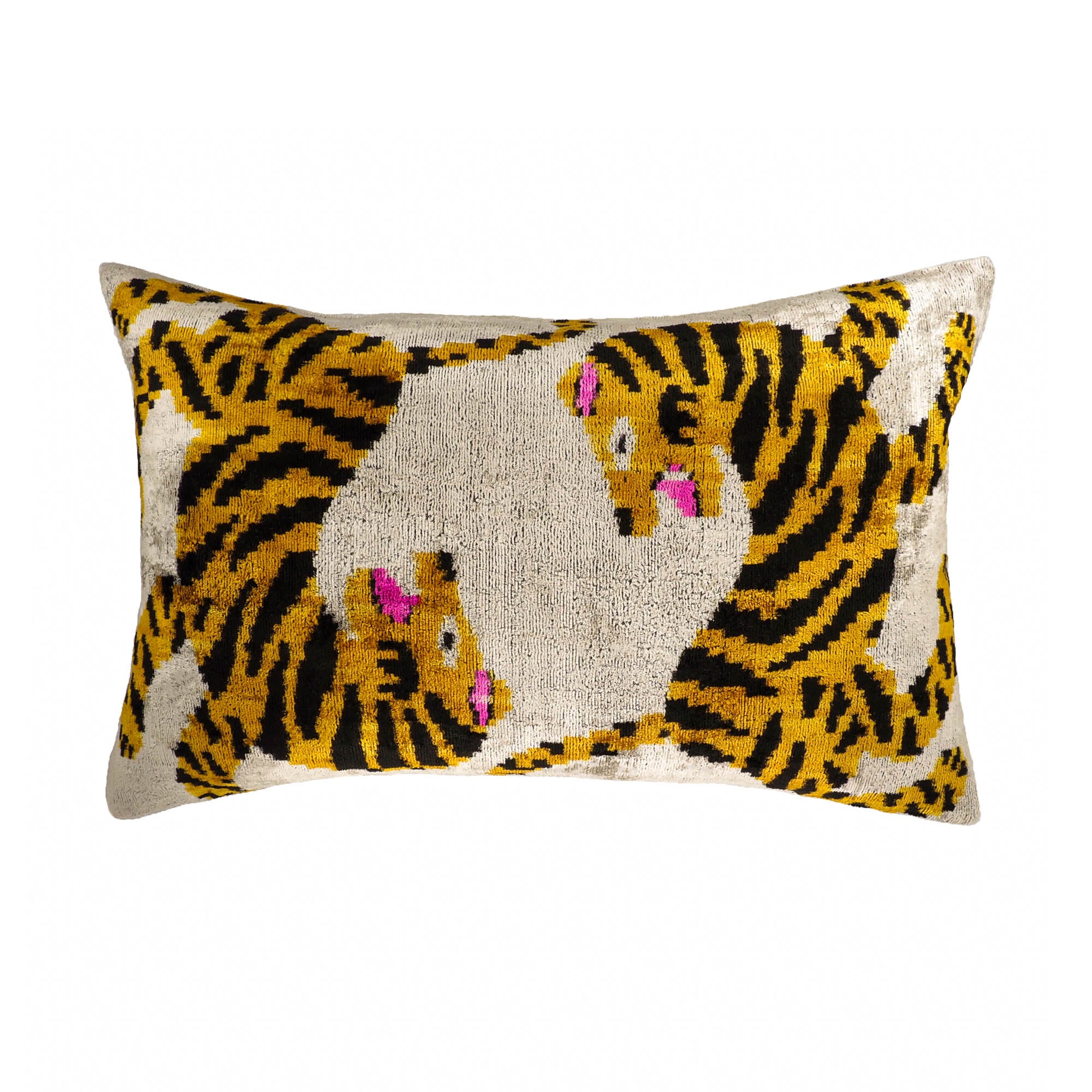 Silk velvet ikat throw pillow with playful tiger pattern in yellow, black, and pink accents.