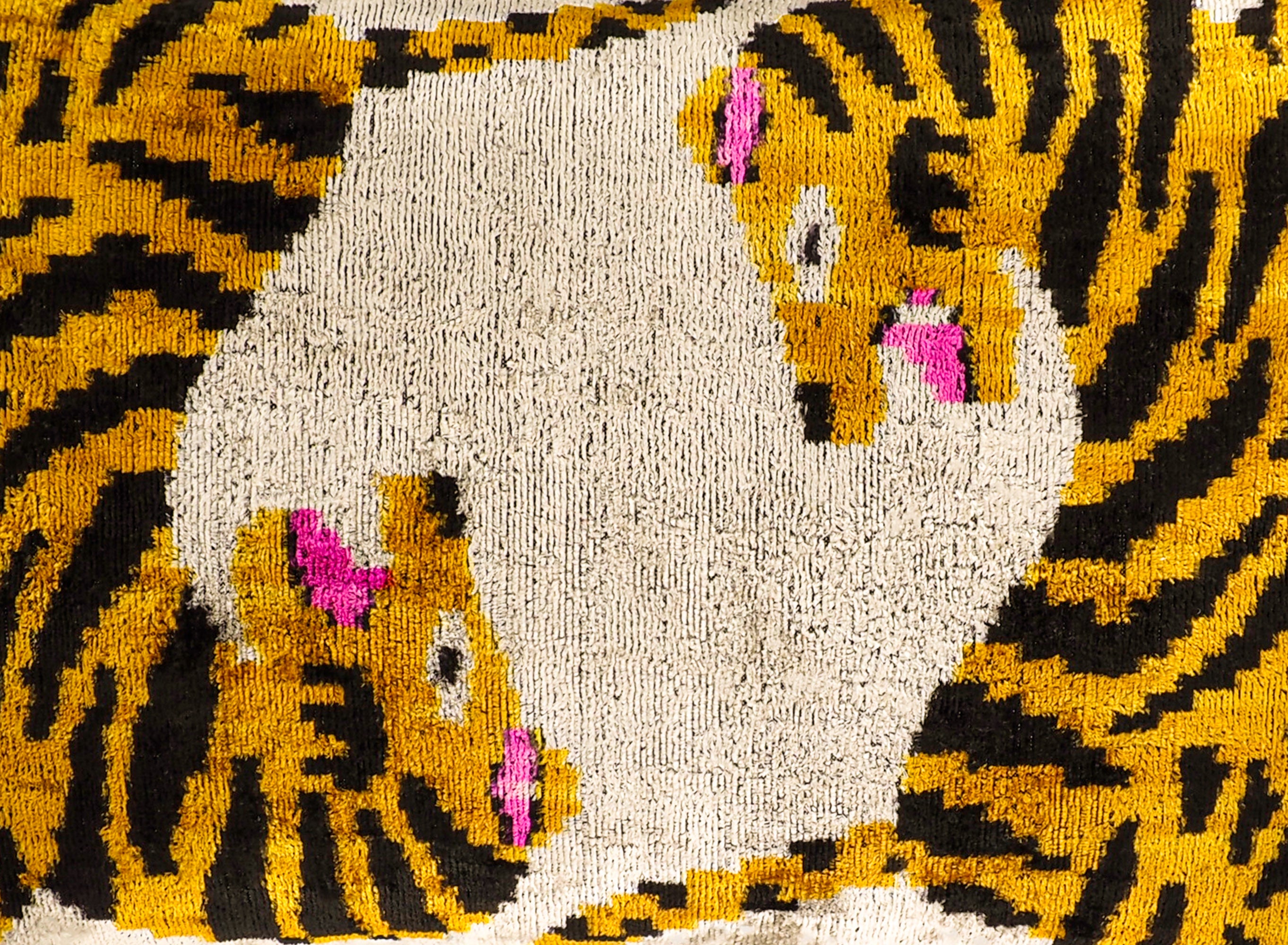 Close-up of Bengali silk velvet ikat pillow showing intricate woven pattern and soft texture, luxury handmade decorative cushion detail