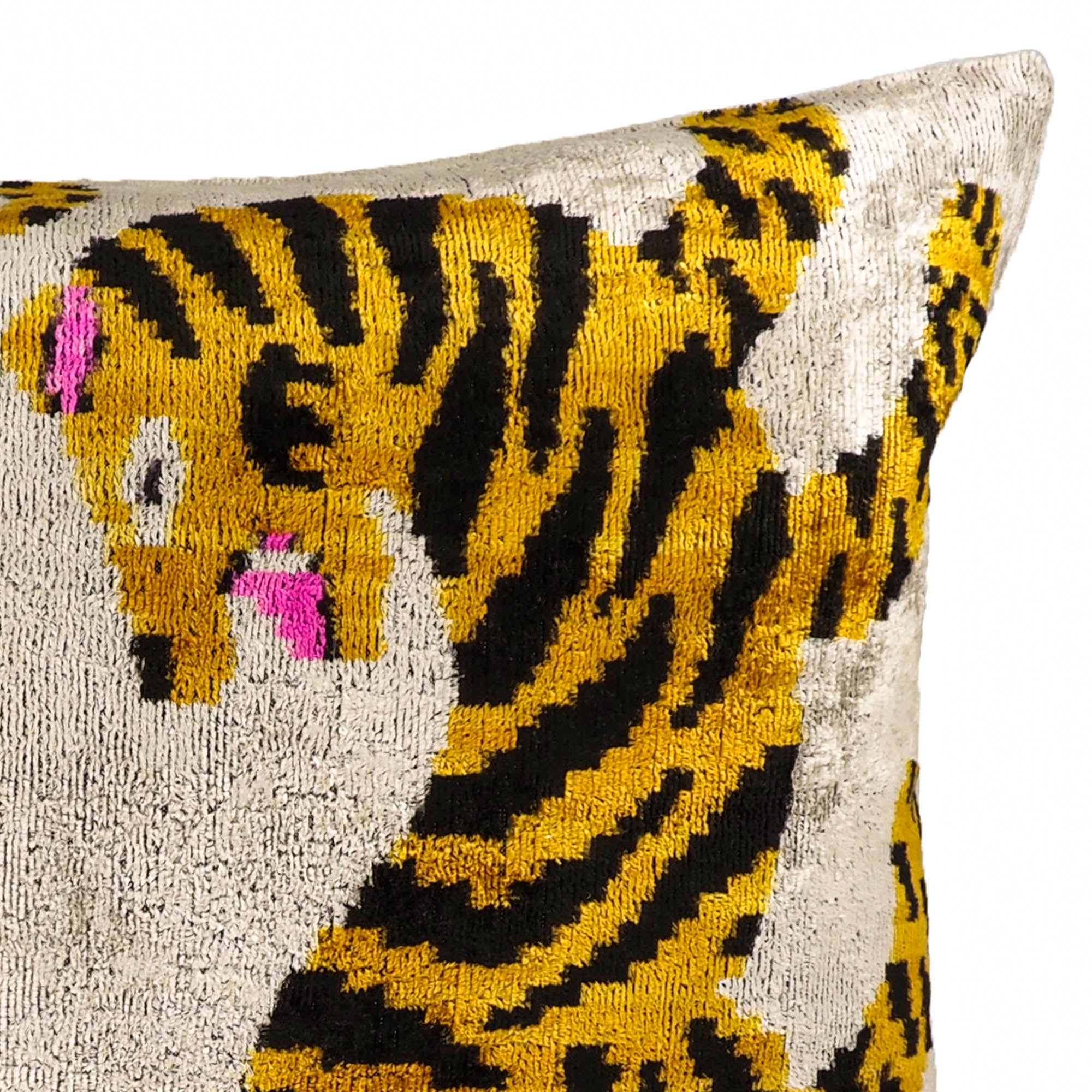 Chouchou Touch rectangular velvet pillow with handwoven tiger design in warm tones.