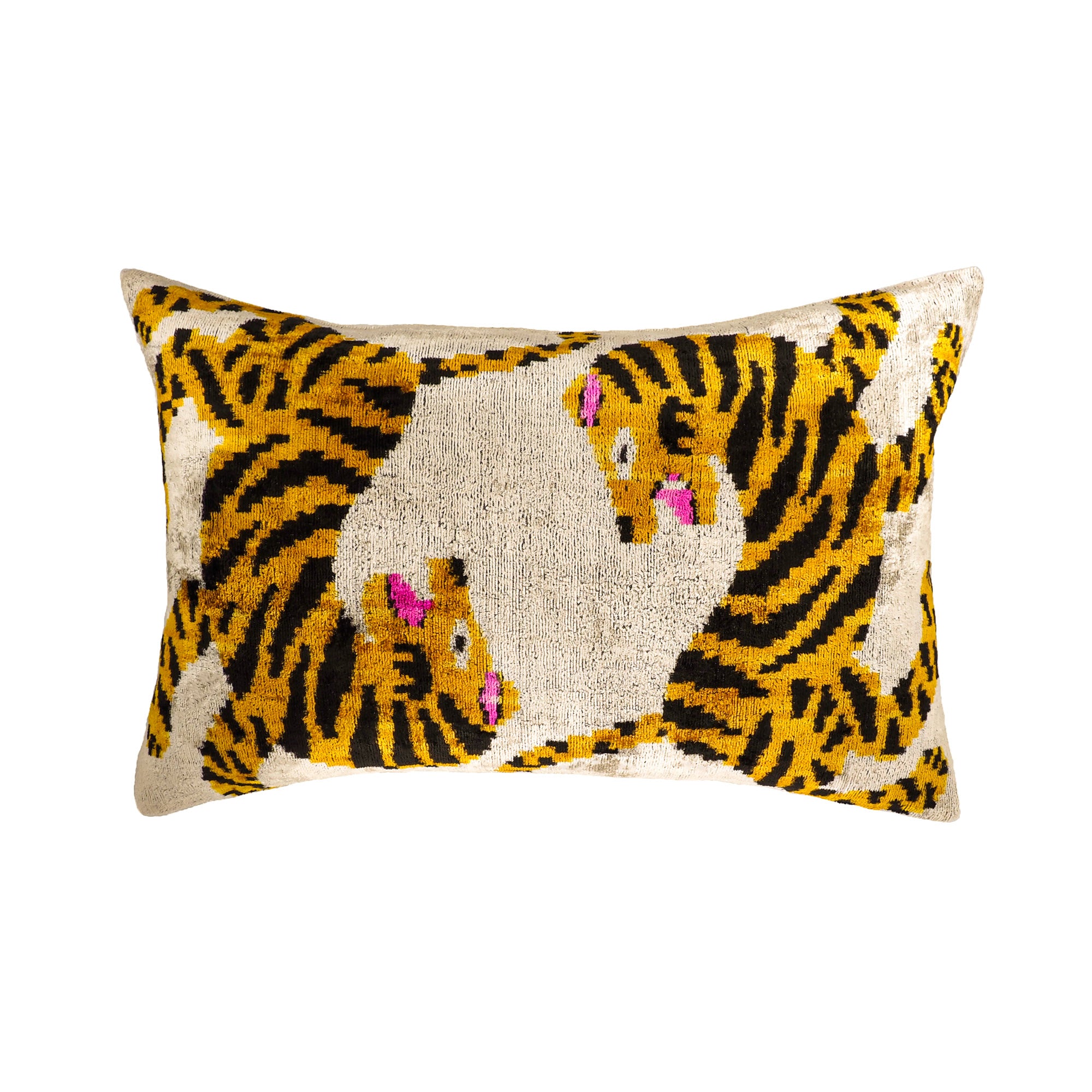 Silk velvet ikat decorative lumbar pillow cover with animal motif in gold, black, and pink tones on a neutral background