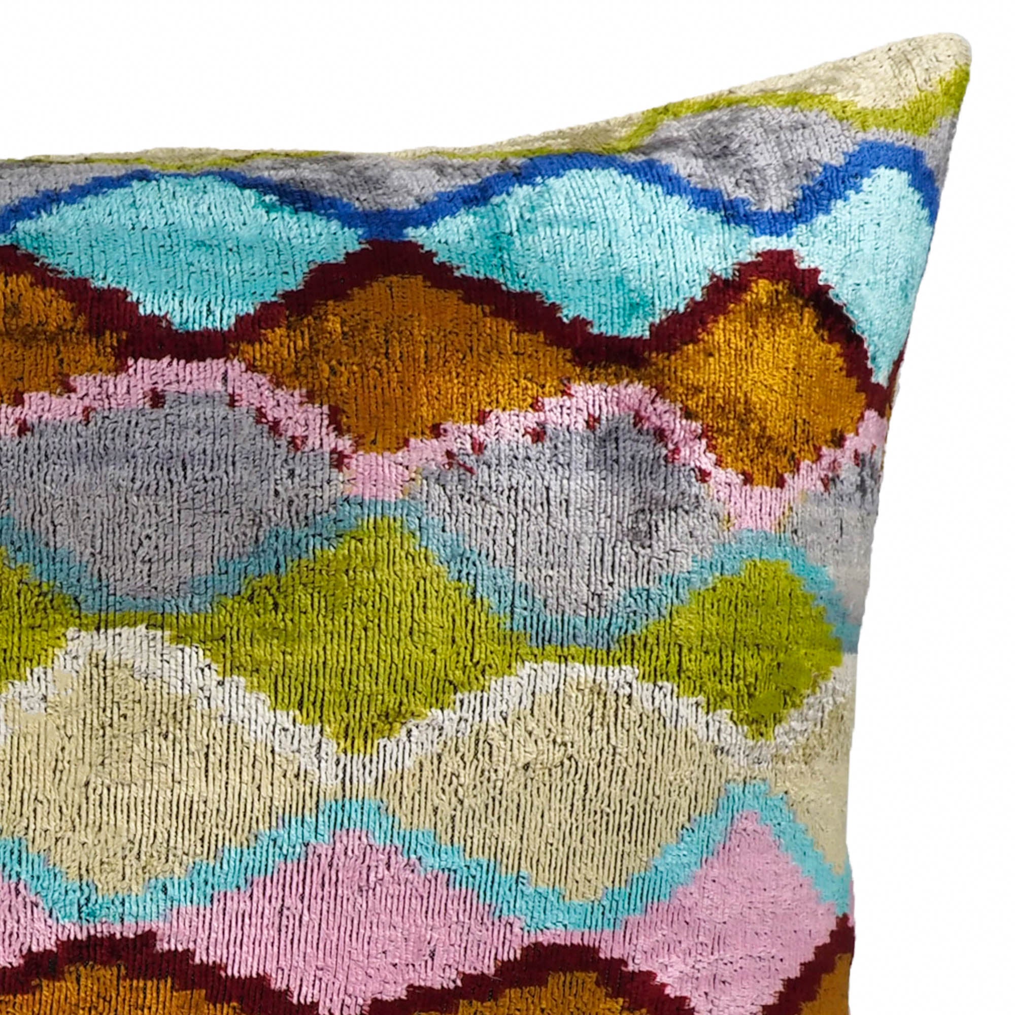 Rectangular silk velvet pillow featuring overlapping diamond shapes in pastel and jewel tones.