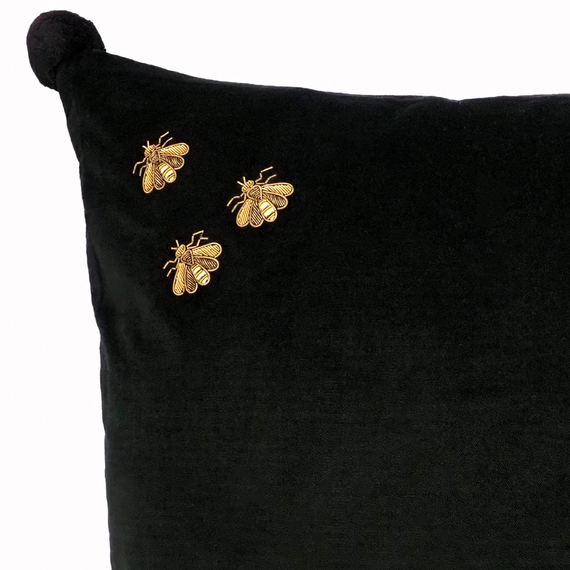 Chouchou Touch black velvet cushion cover featuring golden bees made with metal thread embroidery.