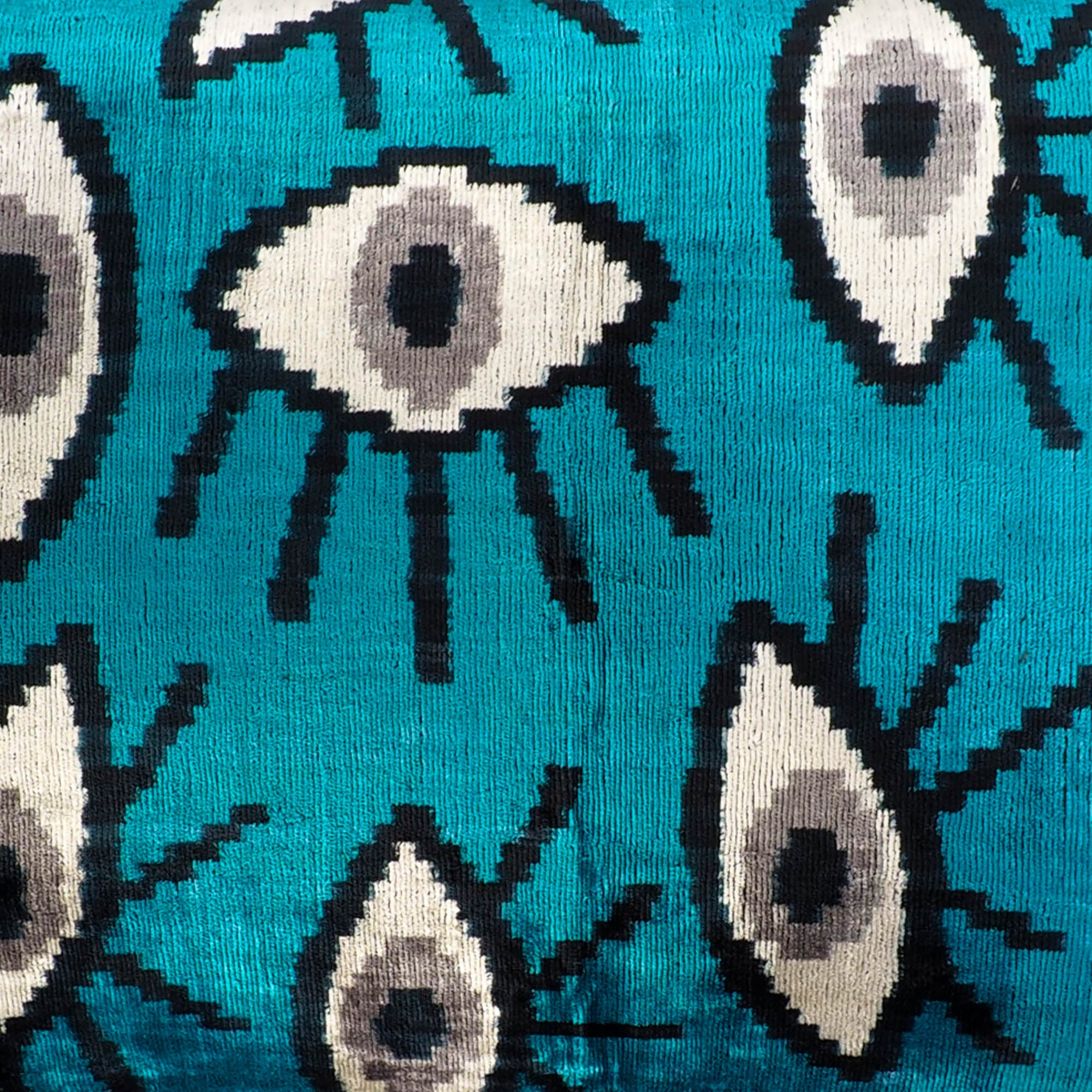 Chouchou Touch Blue Eyes Silk Velvet Ikat Pillow Cover, 16 x 24, offering a contemporary take on traditional Ikat weaving, with bold blue designs on soft, high-quality velvet.