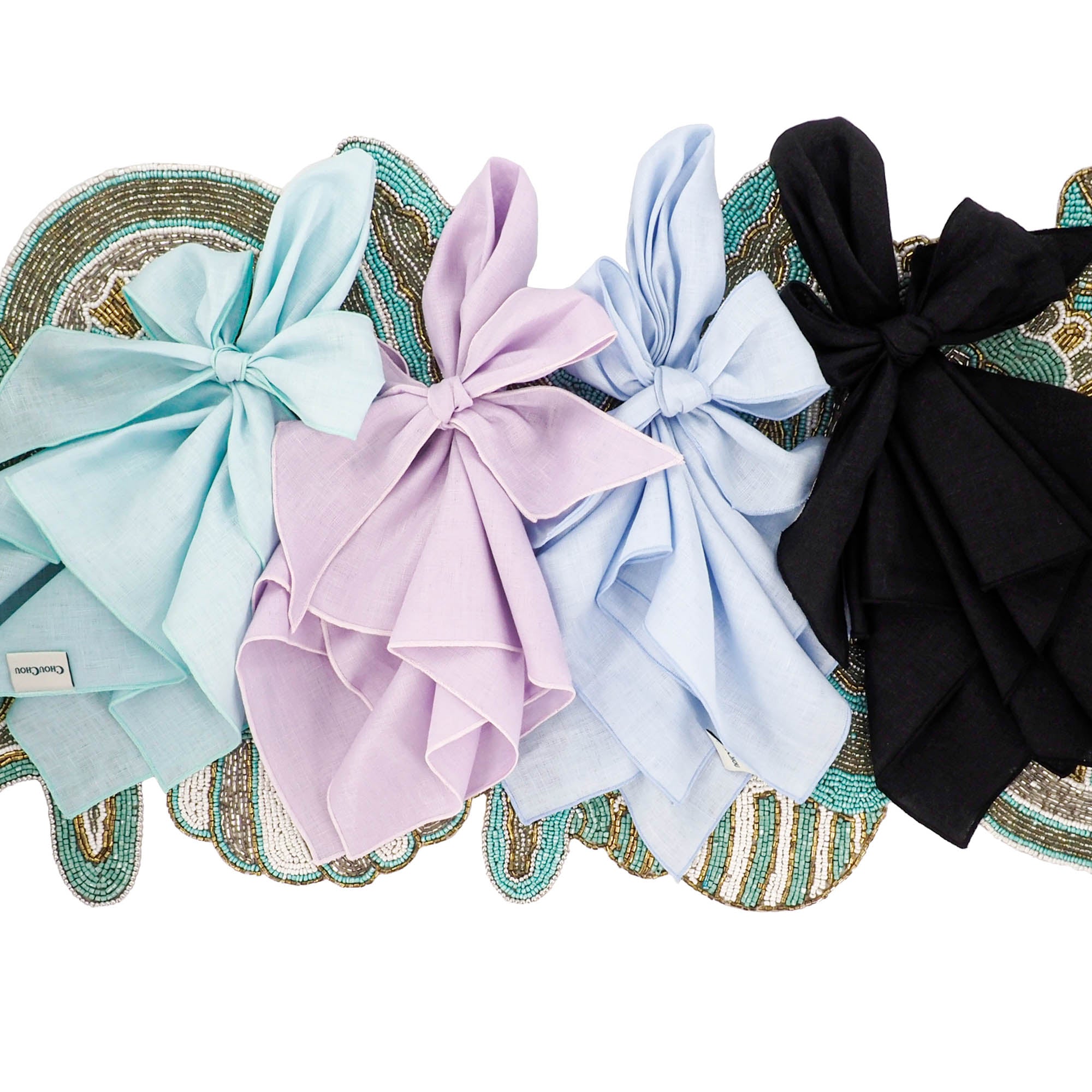 baby blue handcrafted linen napkin iwith different colors linen napkin decorated on the beaded table runner