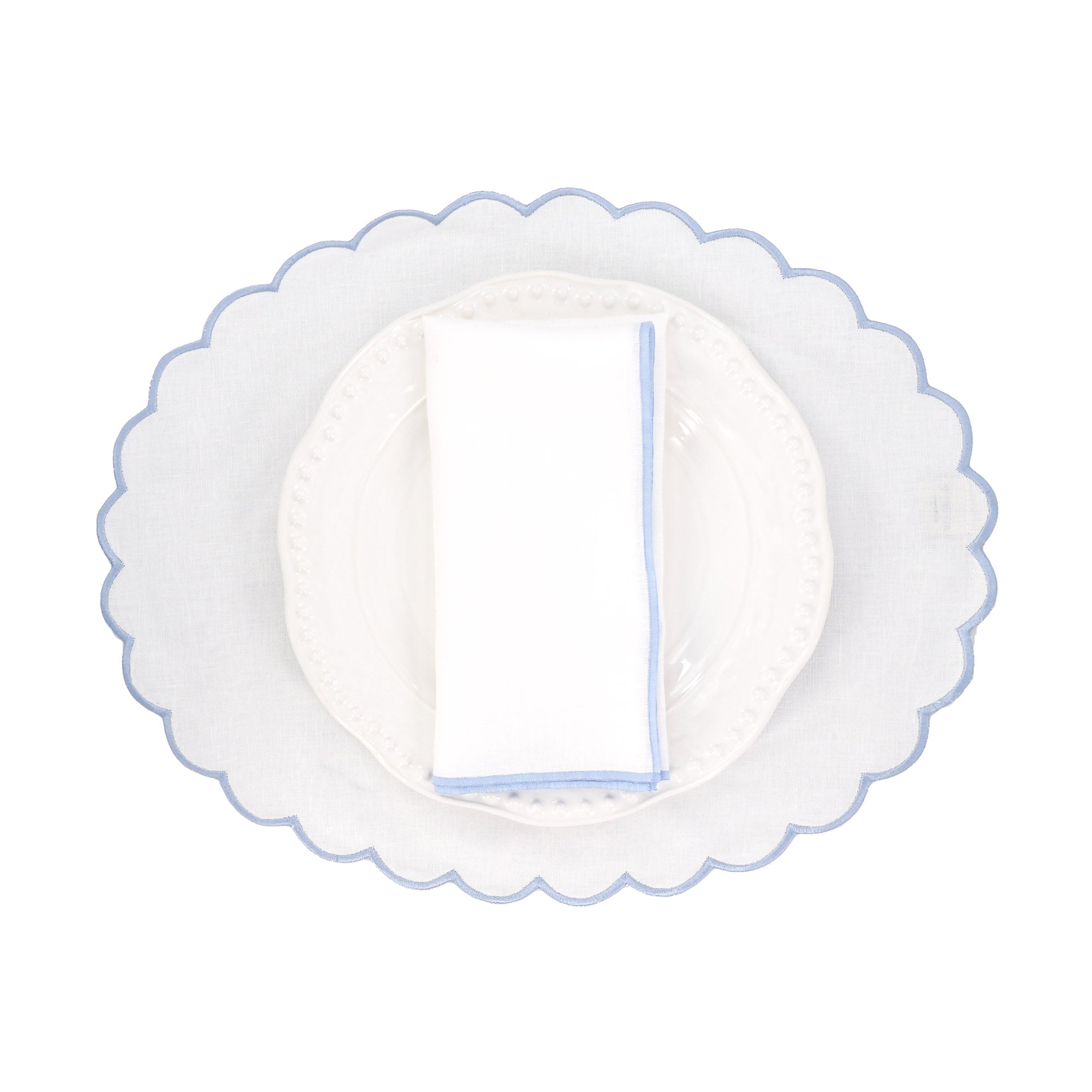 Set of four handcrafted blue linen scalloped placemats - made from 100% premium linen - with elegant curved edges, offering timeless sophistication and luxury for weddings, family and friends gatherings, formal dinners, brunch tables, and everyday entertaining.