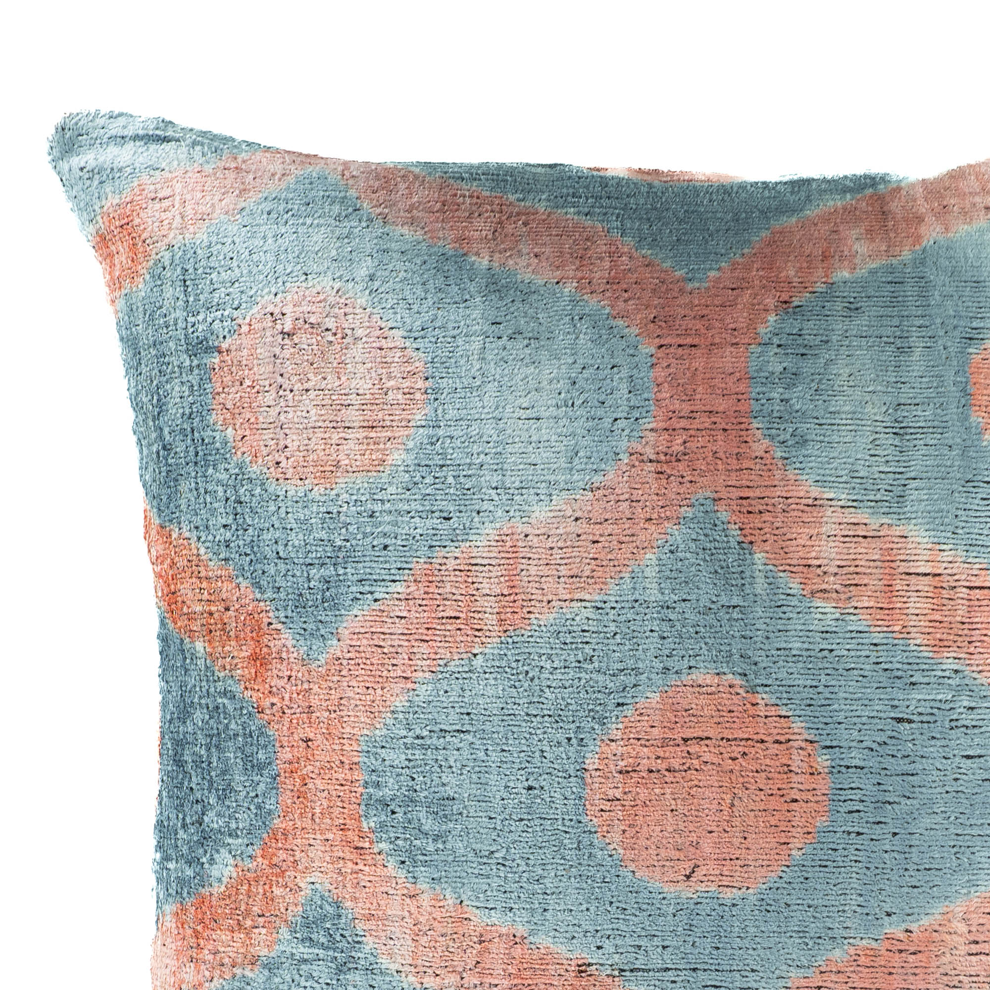 Decorative 100% silk velvet Ikat pillow in blue and peach, ideal for adding texture and charm to any living space.