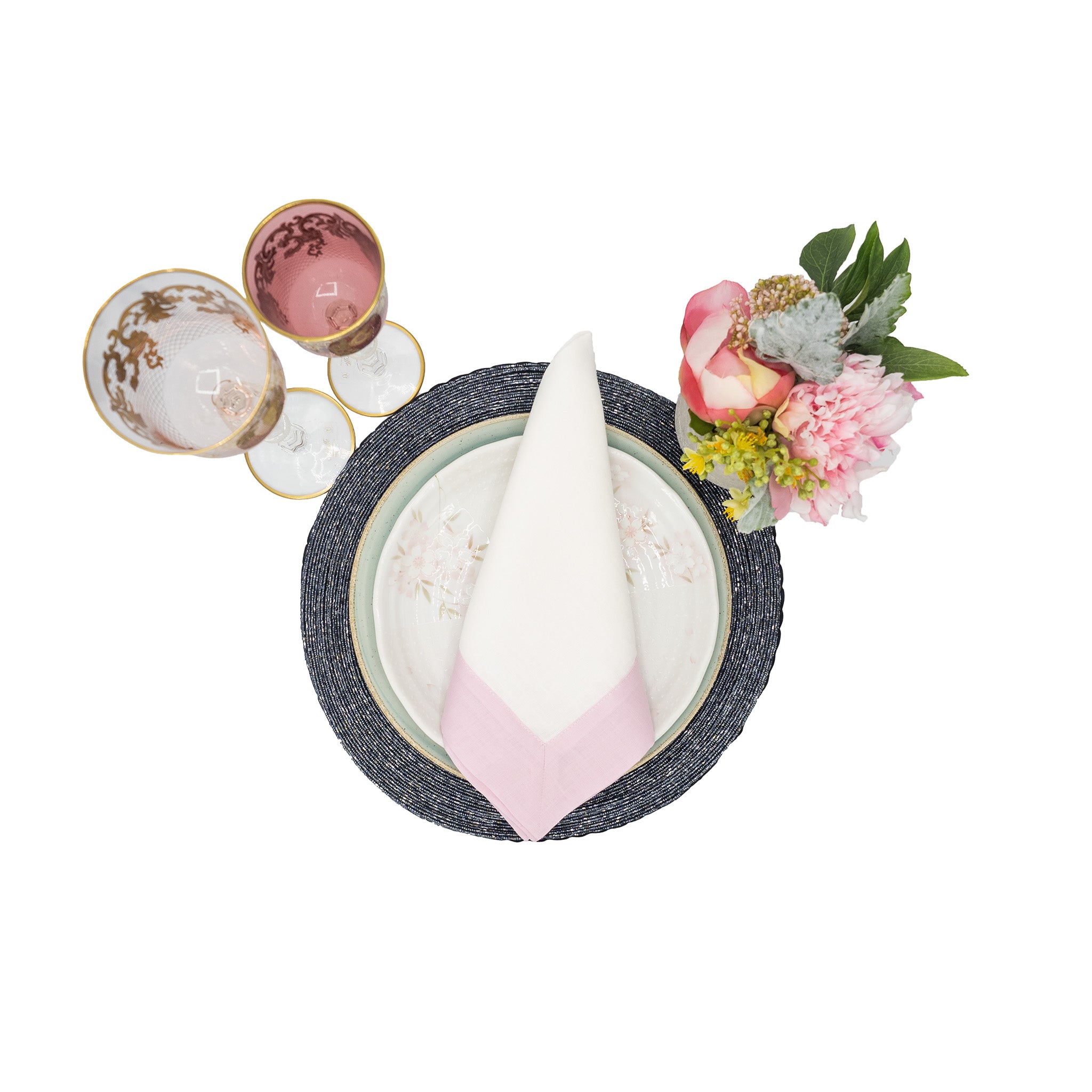 Blush linen napkins with soft double-sided borders, perfect for bringing an elegant and timeless feel to your dining experience.