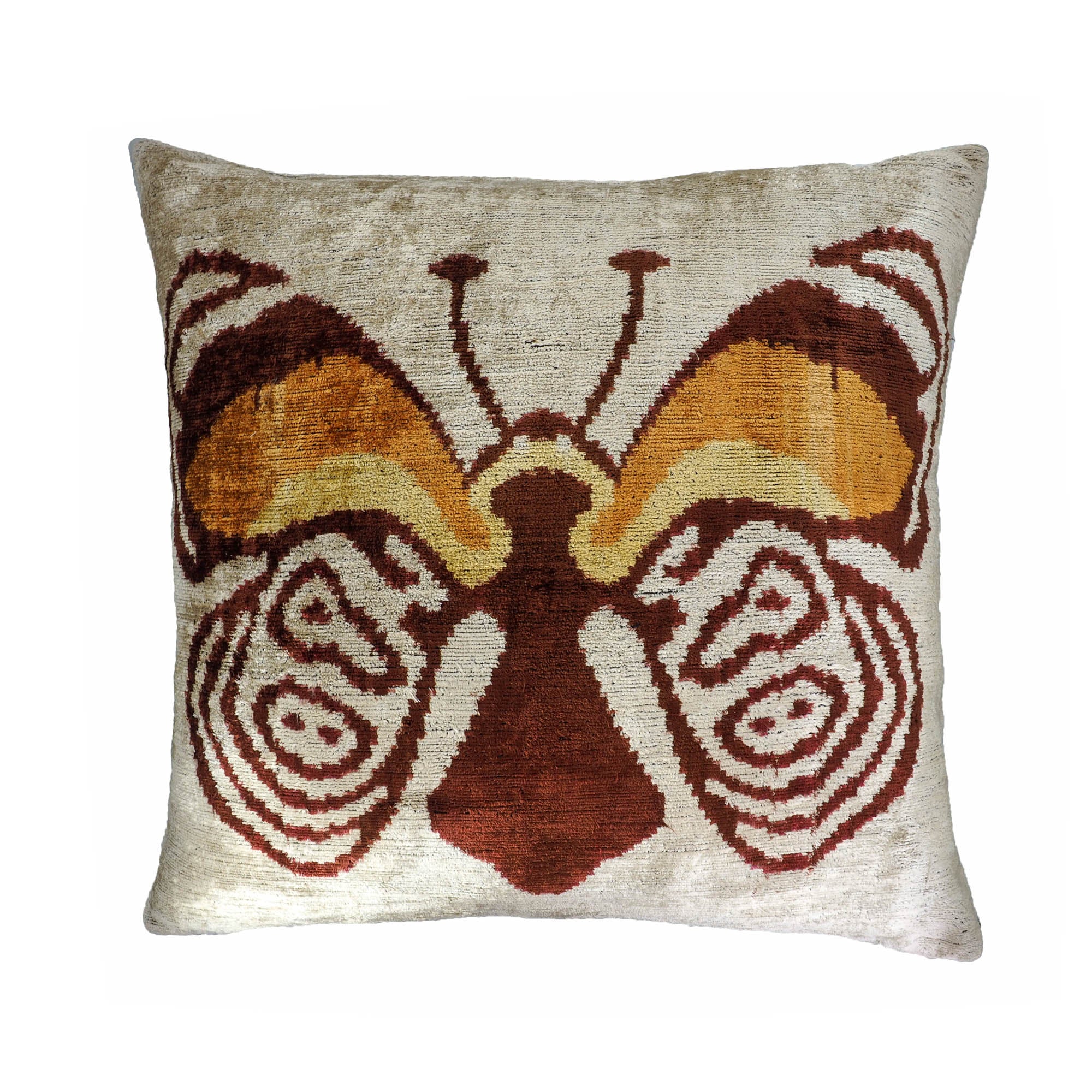 Chouchou Touch butterfly ikat pillow with bold wings in warm copper, amber, and cream silk velvet.