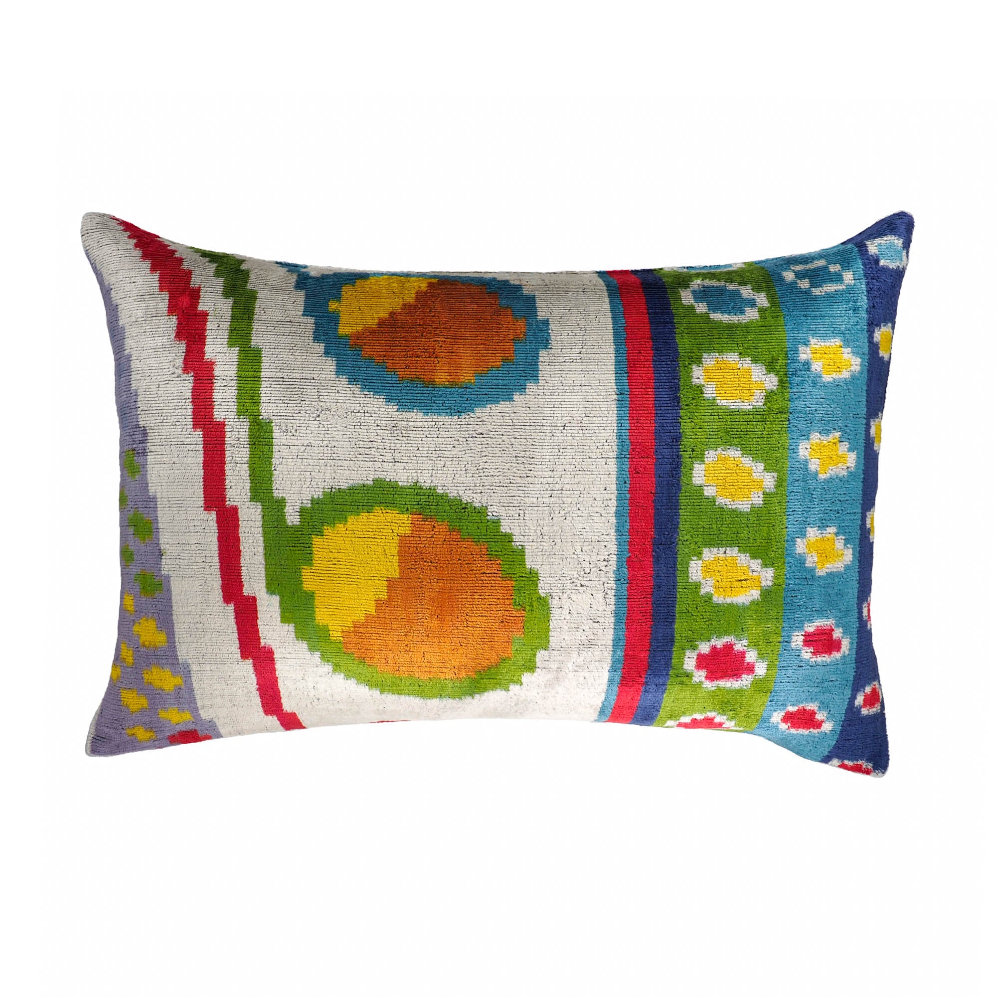 Colorful silk velvet ikat throw pillow with circular and striped circus-inspired patterns.