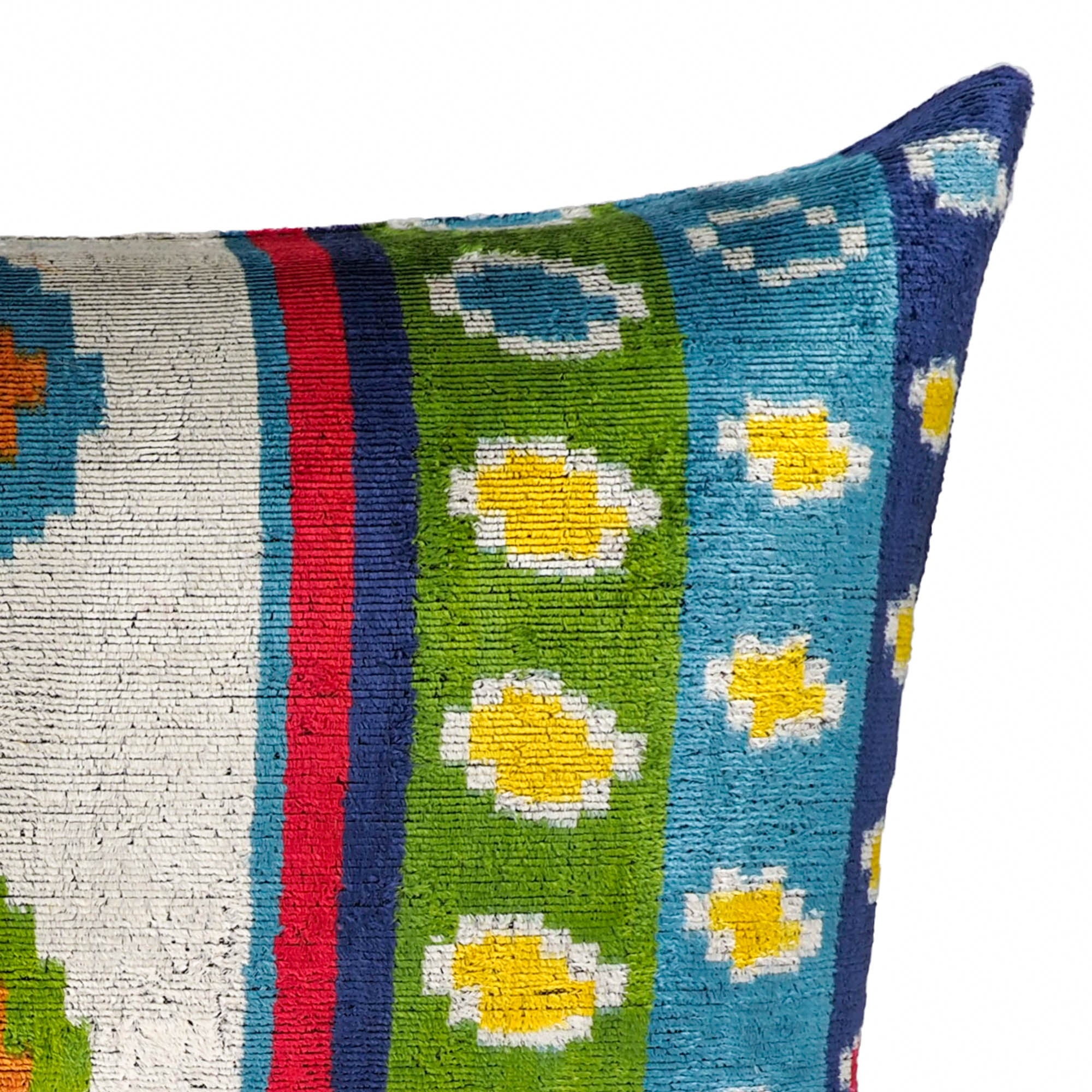 Playful ikat cushion with bold geometric shapes and rich jewel-toned palette.