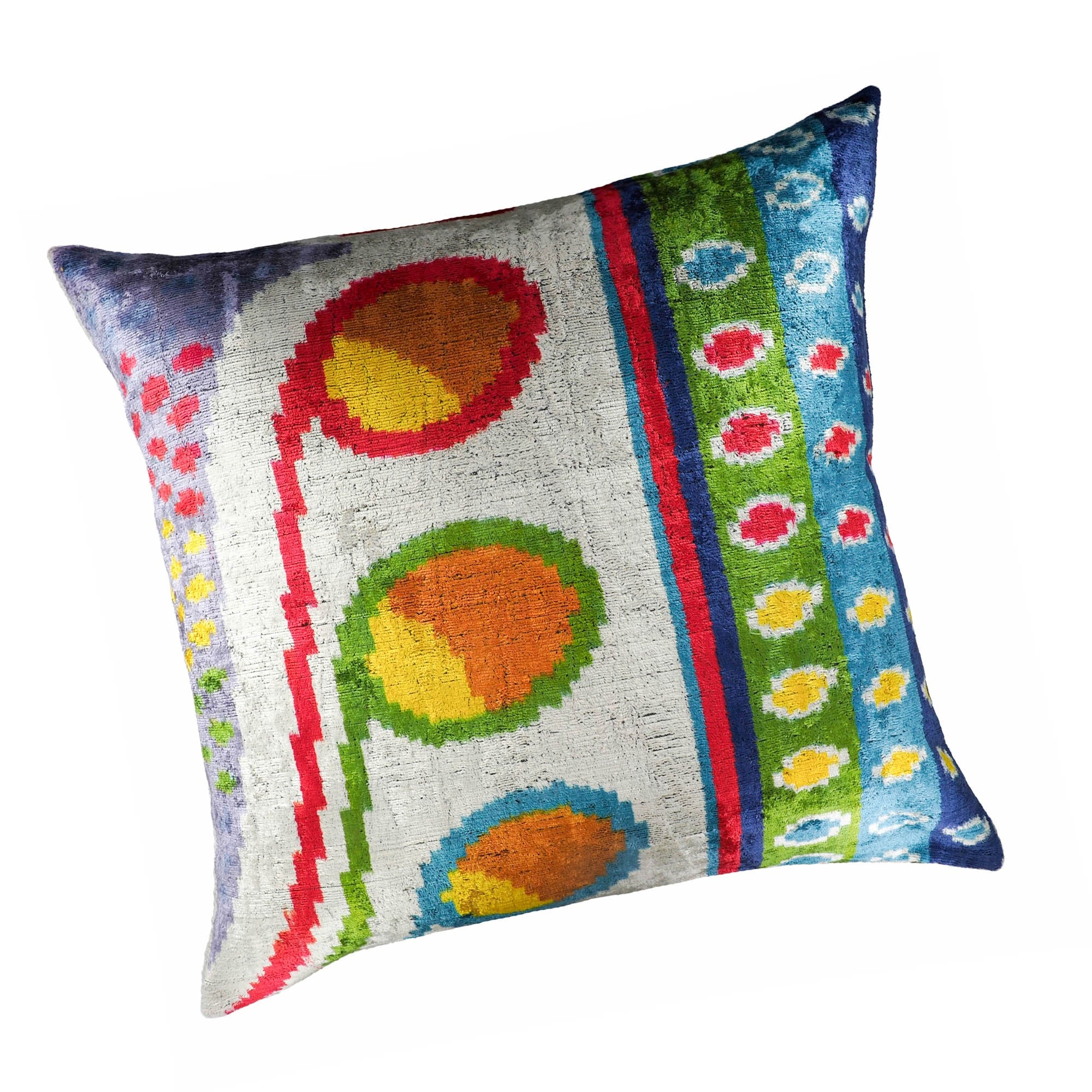 Chouchou Touch Circus pillow cover featuring large circular ikat motifs and rainbow patterns.
