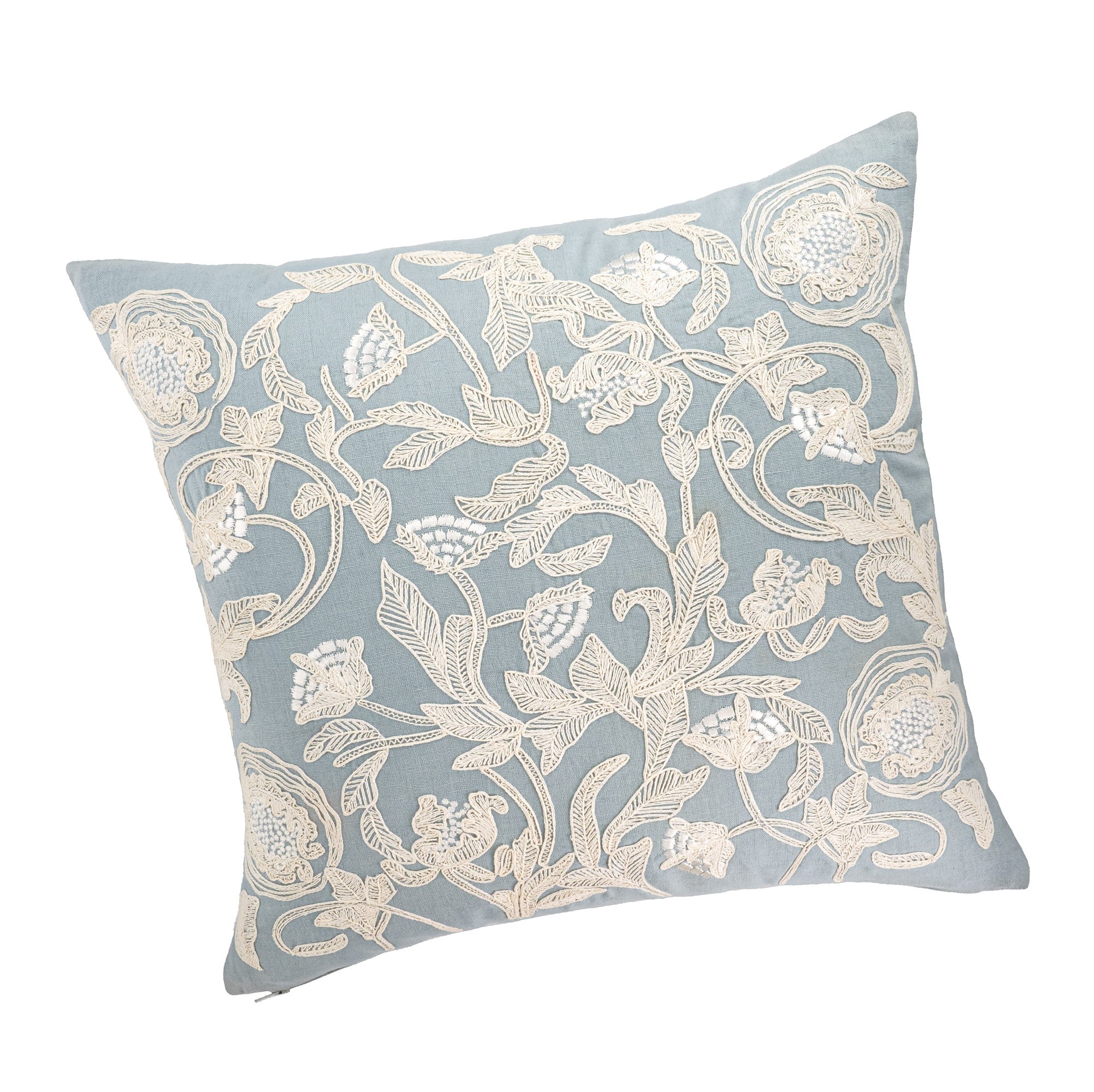Hand-embroidered floral pillow cover in light blue linen with cream silk thread embroidery.