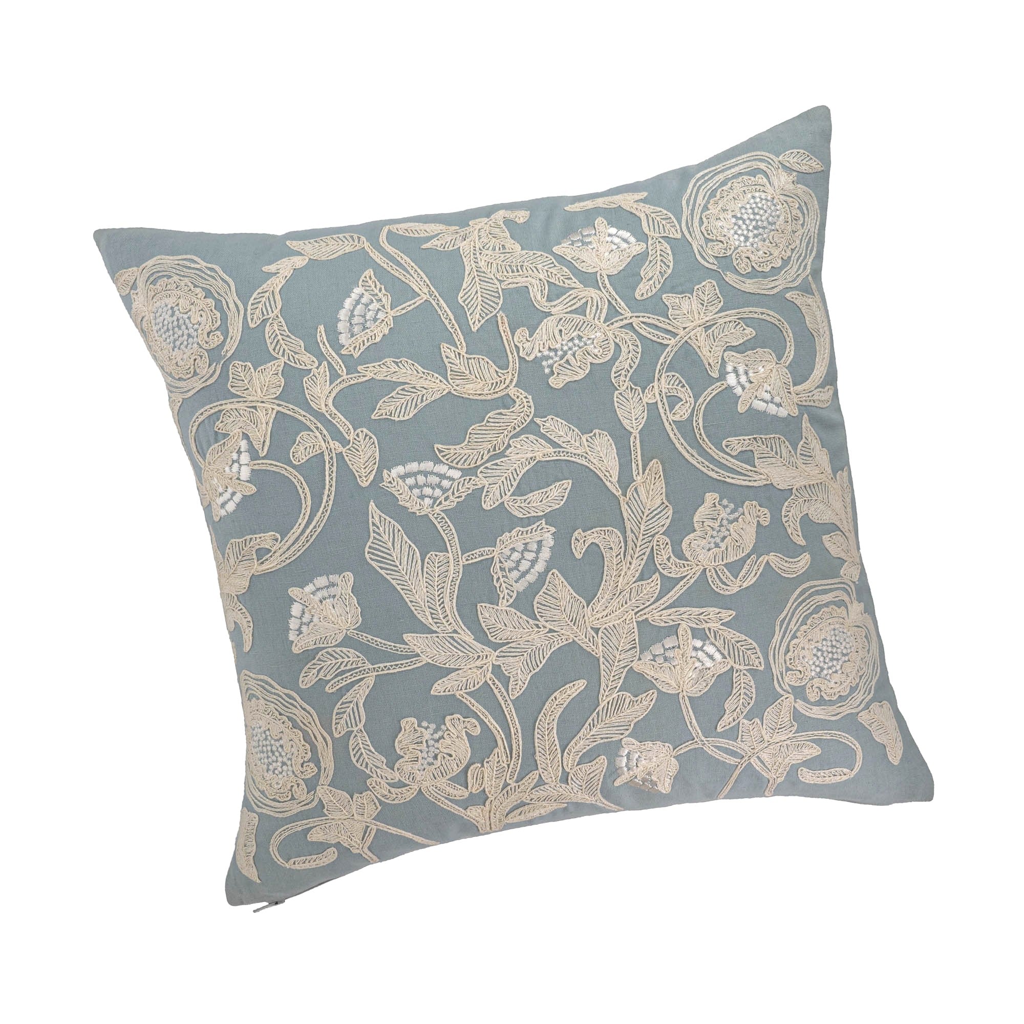 Hand-embroidered floral pillow cover in light blue linen with cream silk thread embroidery.
