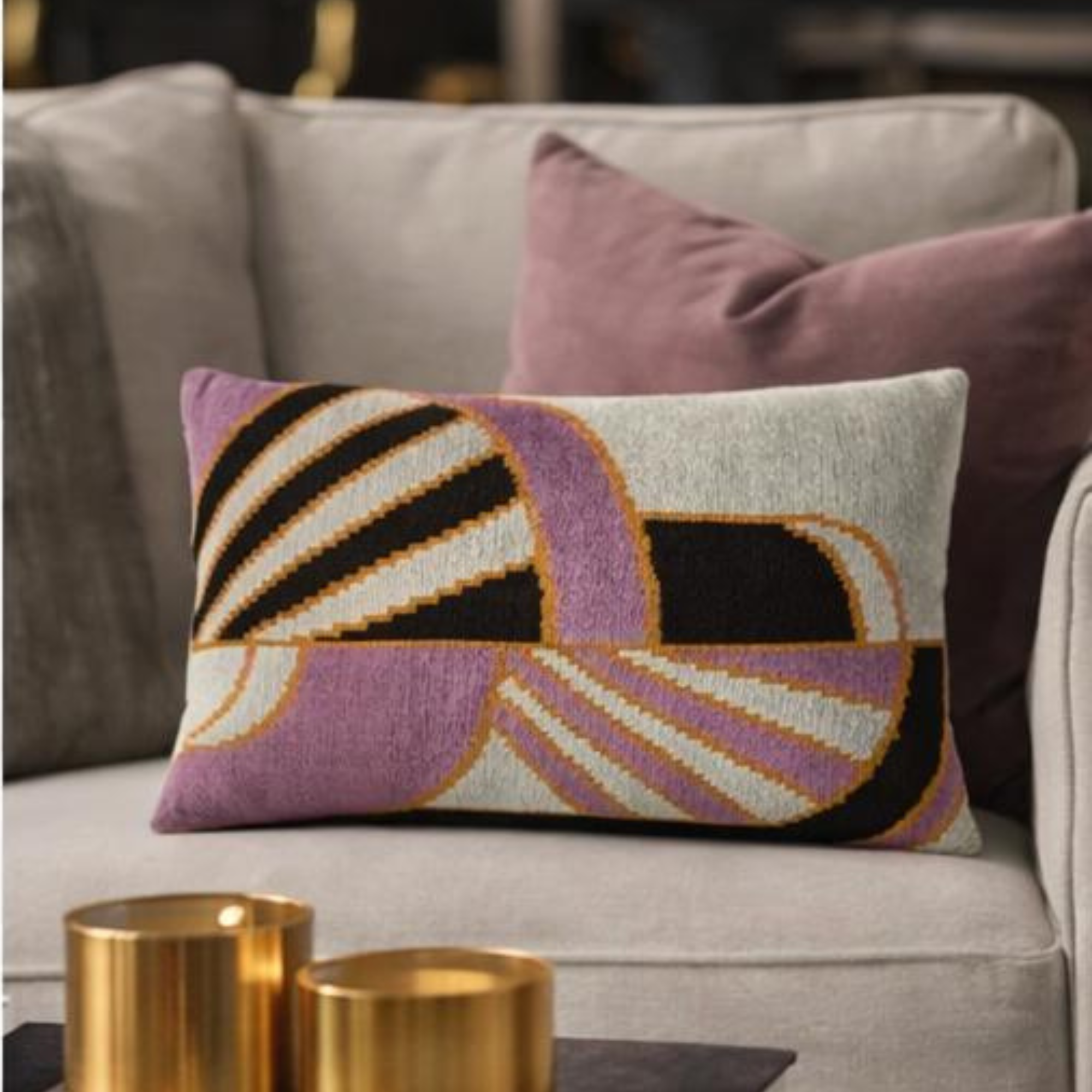 geometric embroidered silk velvet throw pillow cover 16x24 styled on a neutral sofa with gold decor accents