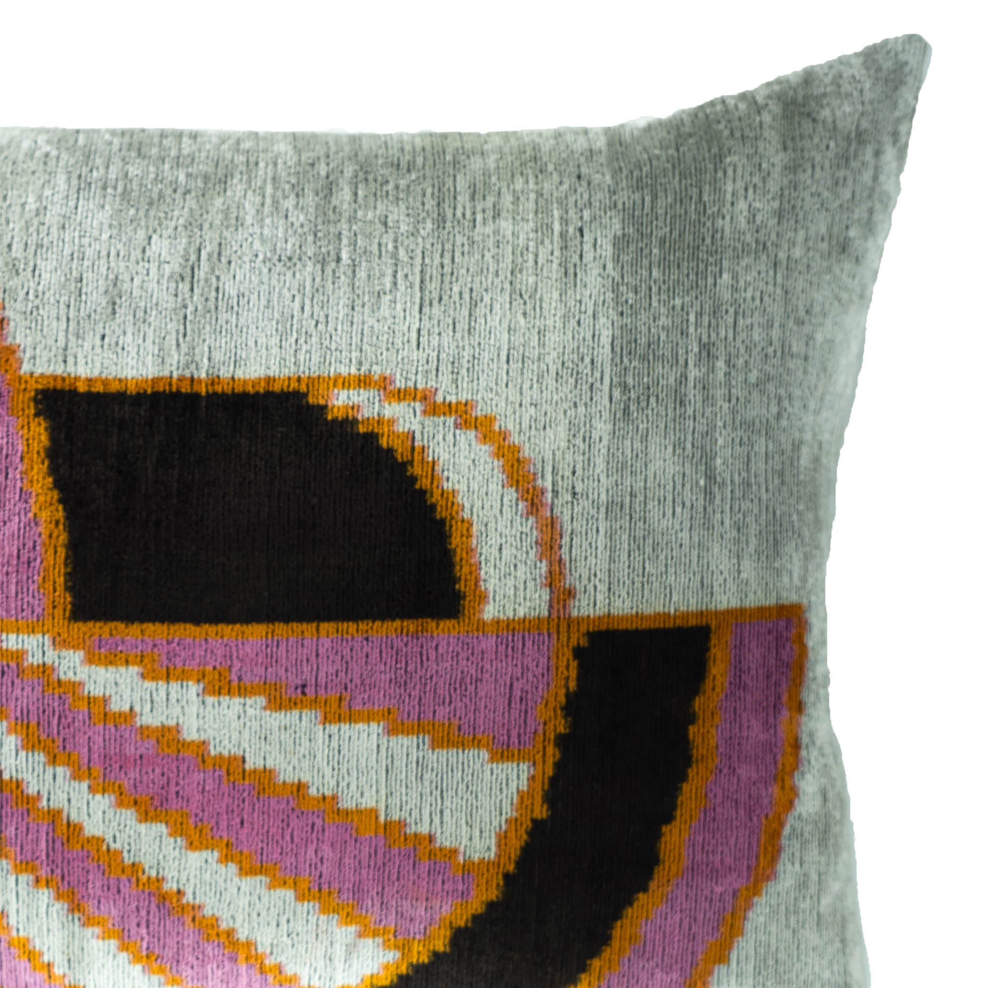 close-up of geometric embroidered silk velvet throw pillow cover 16x24 in pink, black and ivory tones
