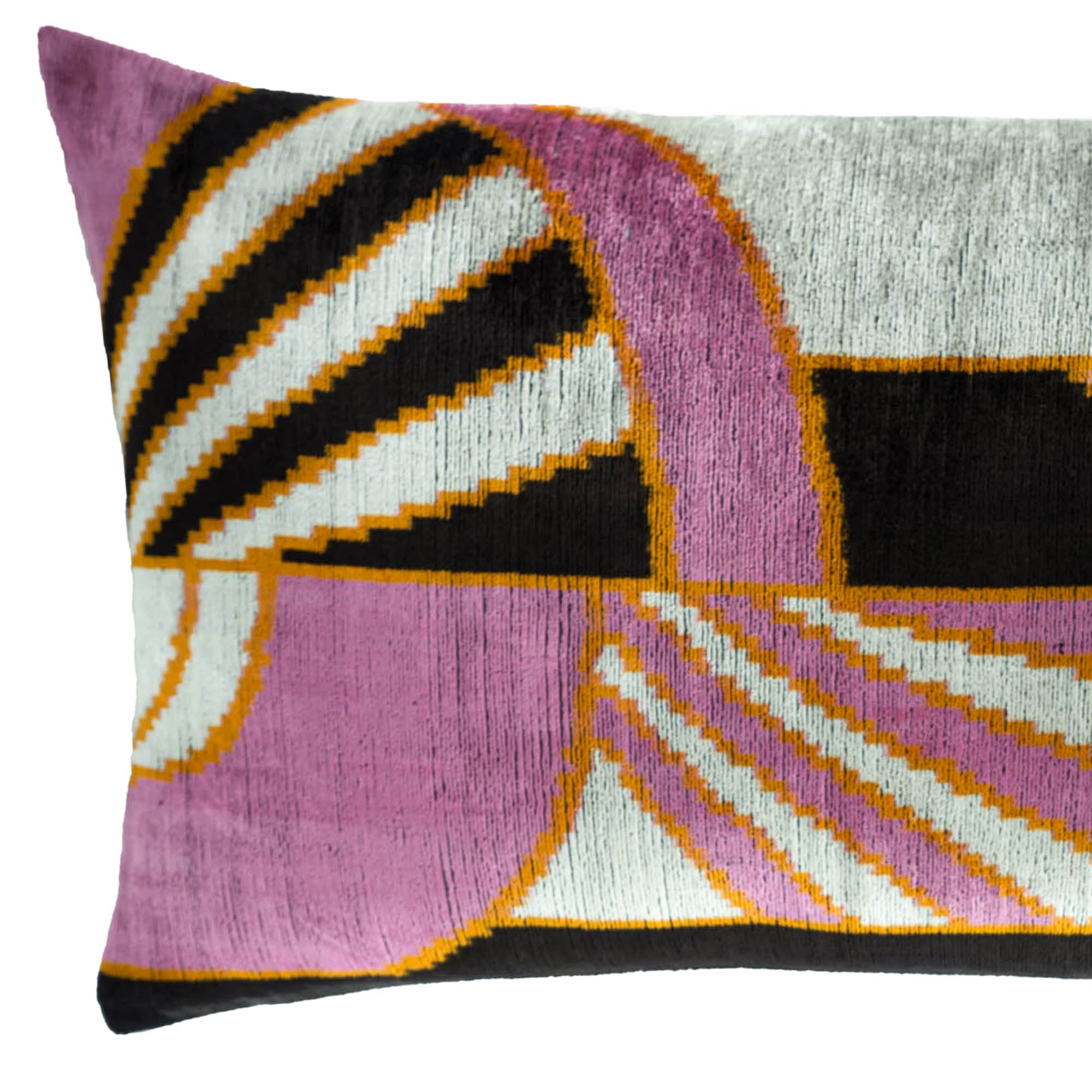 Chouchou Touch Deco Silk Velvet Ikat Throw Pillow, 16" x 24", featuring bold geometric patterns in pink, black, and gold .