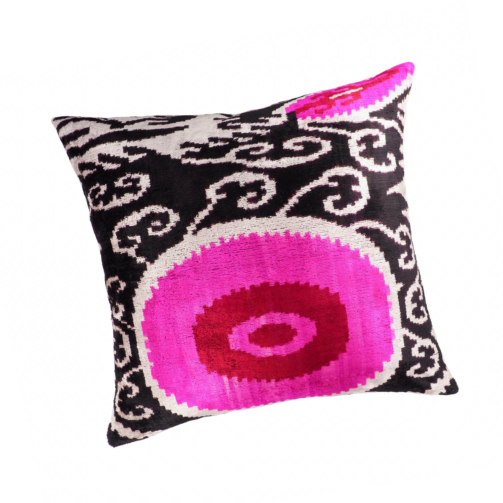 Chouchou Touch square silk pillow featuring pink circular motif and intricate swirling patterns.