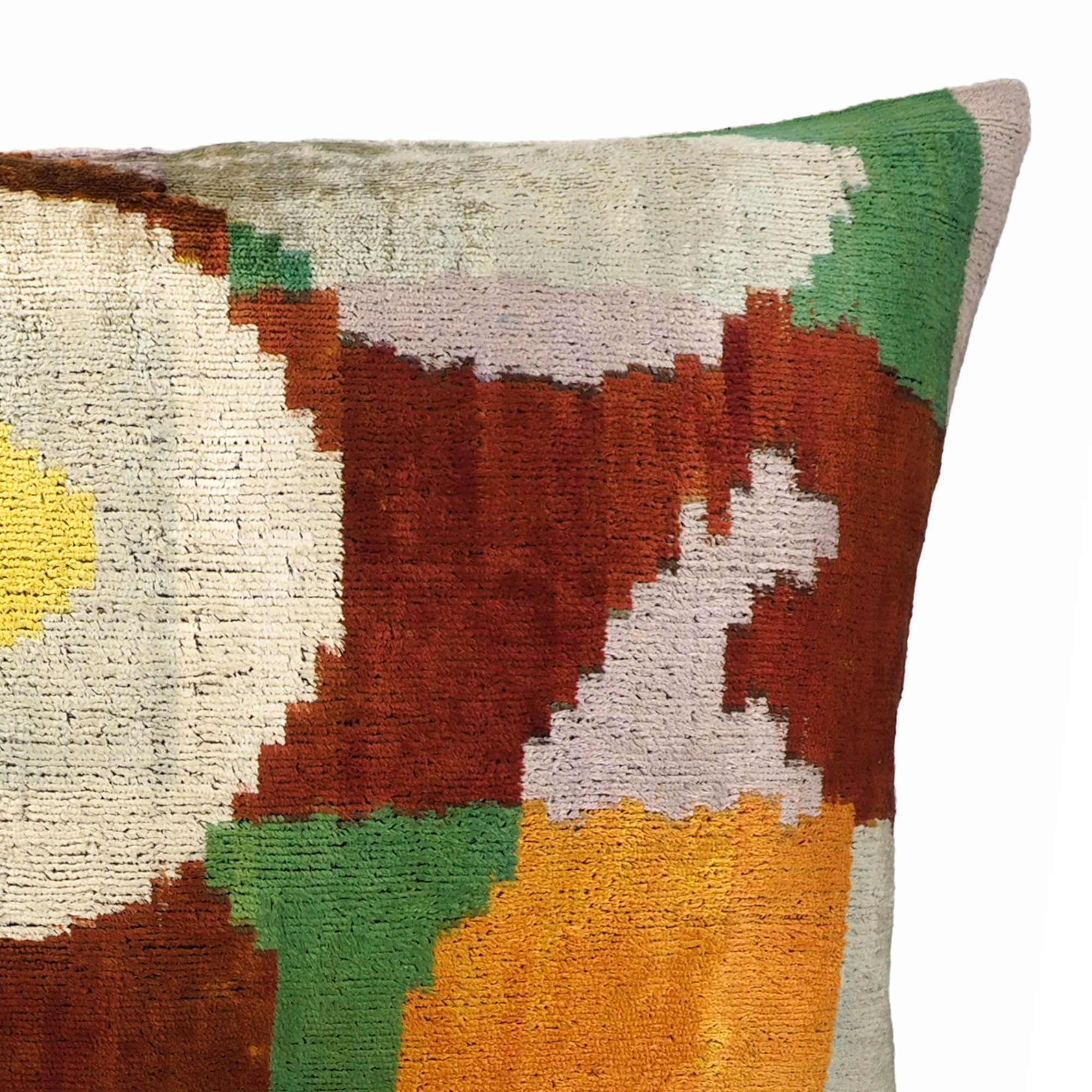 Chouchou Touch Everglades Silk Velvet Ikat Pillow Cover, 16 x 24, made of 100% silk velvet and adorned with timeless Ikat patterns, offering a plush touch for your sofa.
