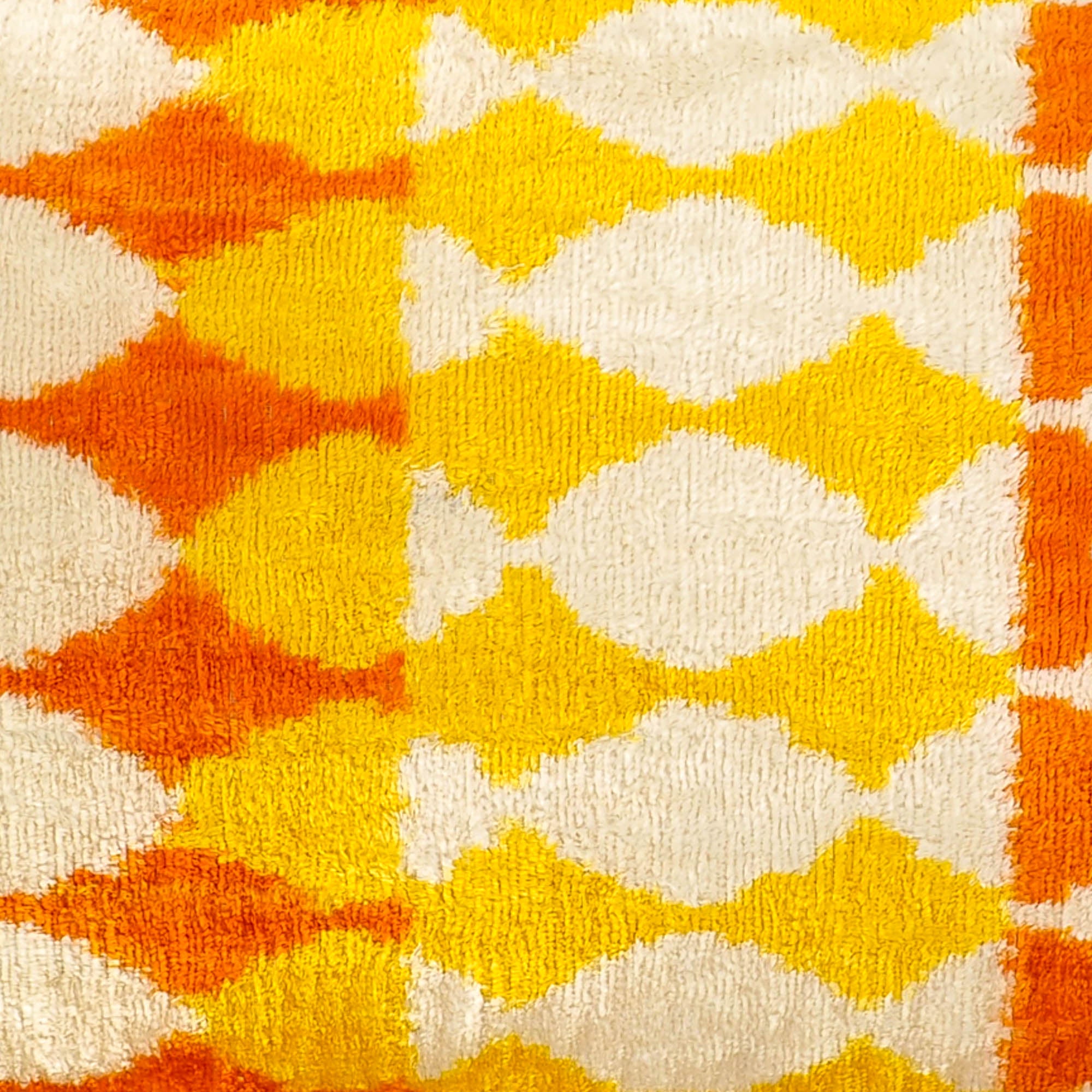Elegant Giallo Silk Velvet Ikat Pillow Cover, 16 x 24, showcasing vibrant golden yellow hues and intricate weaving patterns for a refined interior accent.