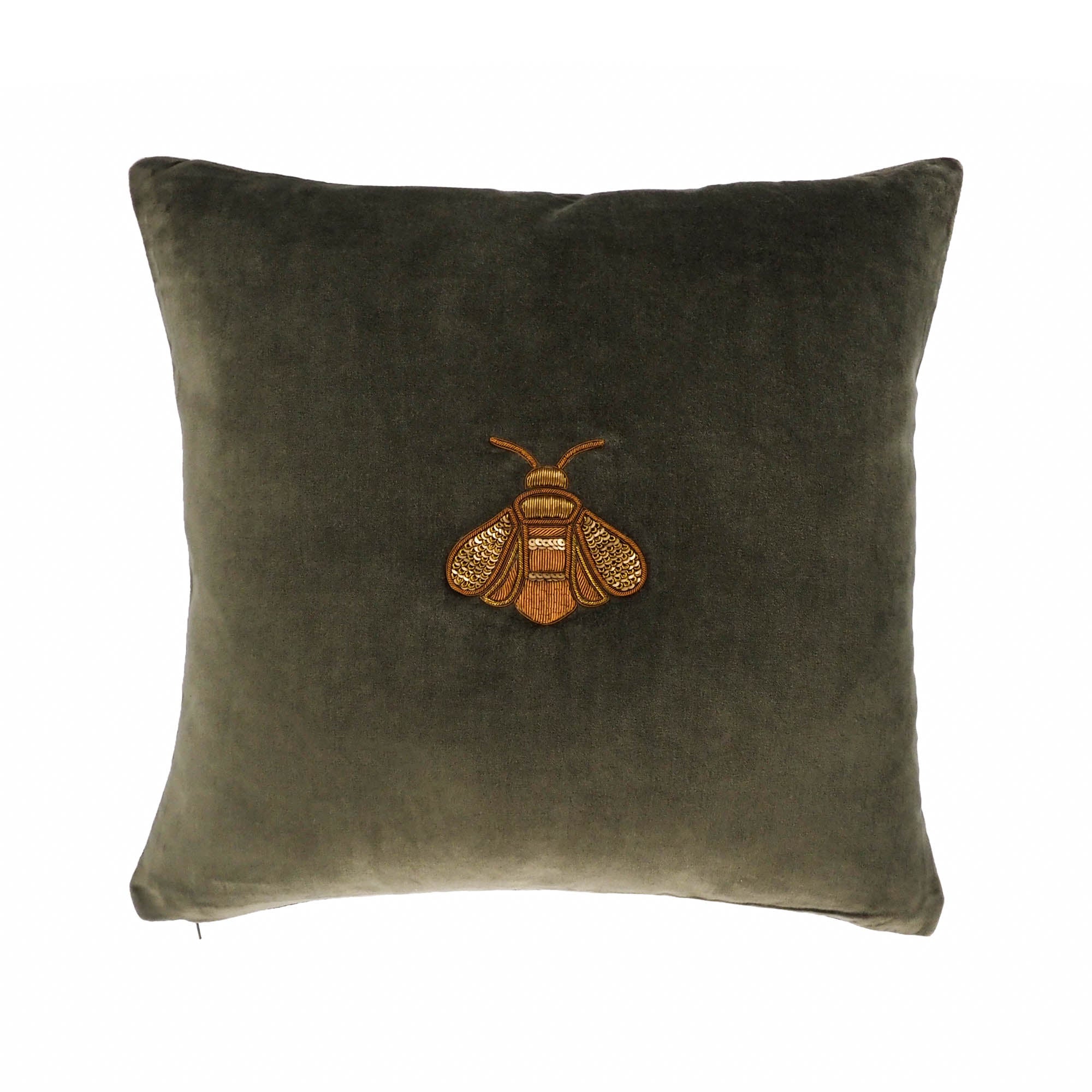 Green velvet throw pillow with central gold bee embroidery by Chouchou Touch.