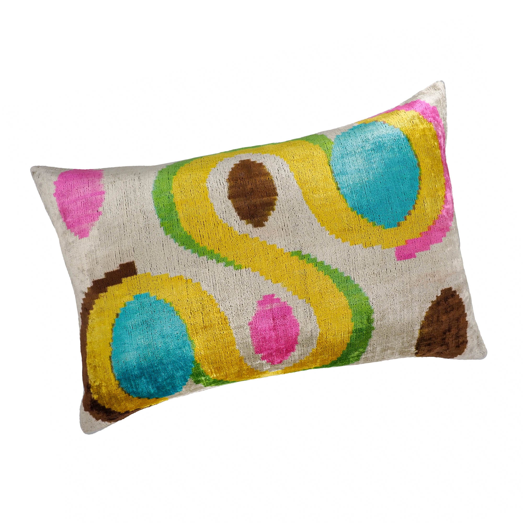 Chouchou Touch colorful silk velvet pillow featuring bold looped ikat motifs on cream background.