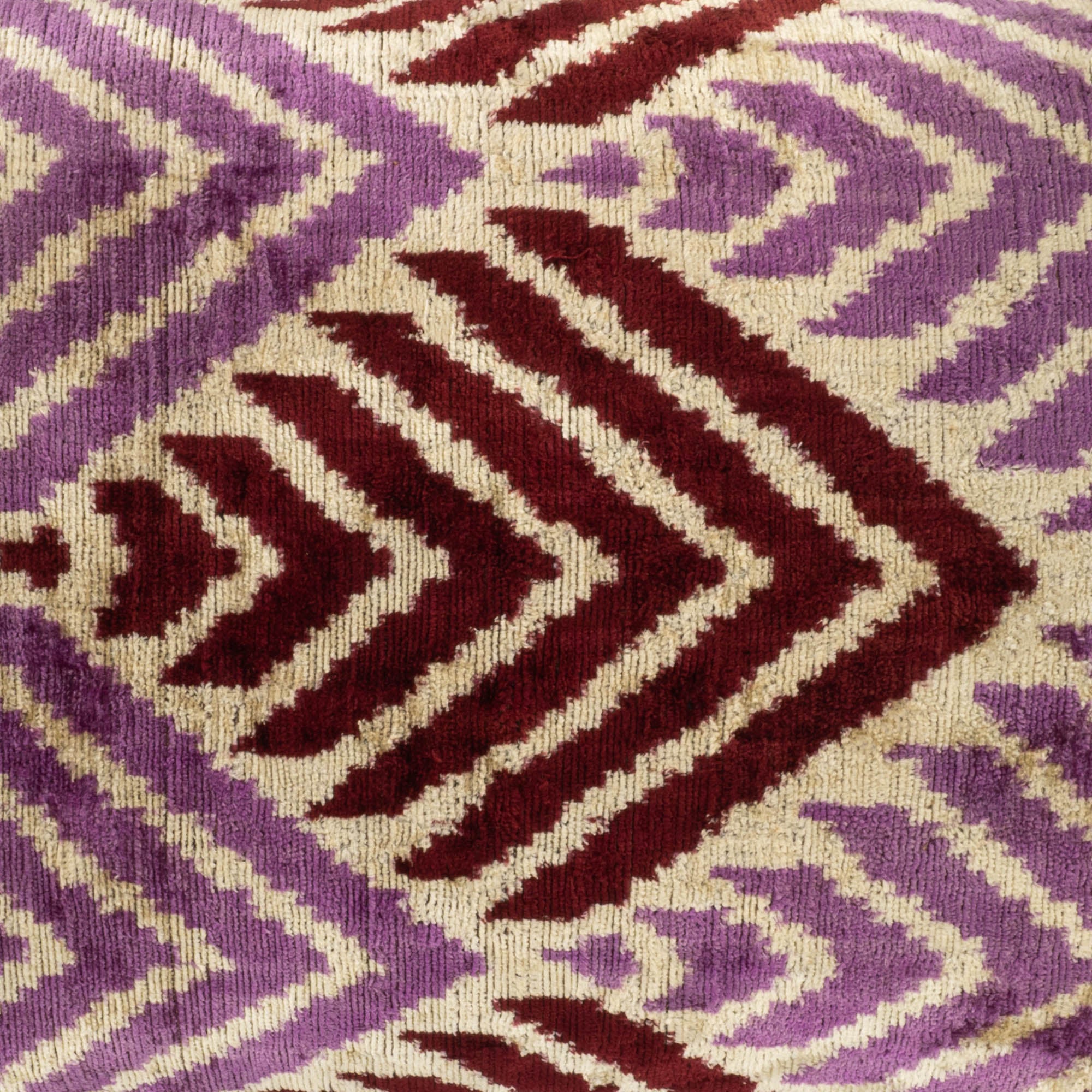 Premium Ikat pillow cover with a sophisticated geometric motif, perfect for enhancing your living room's decor.