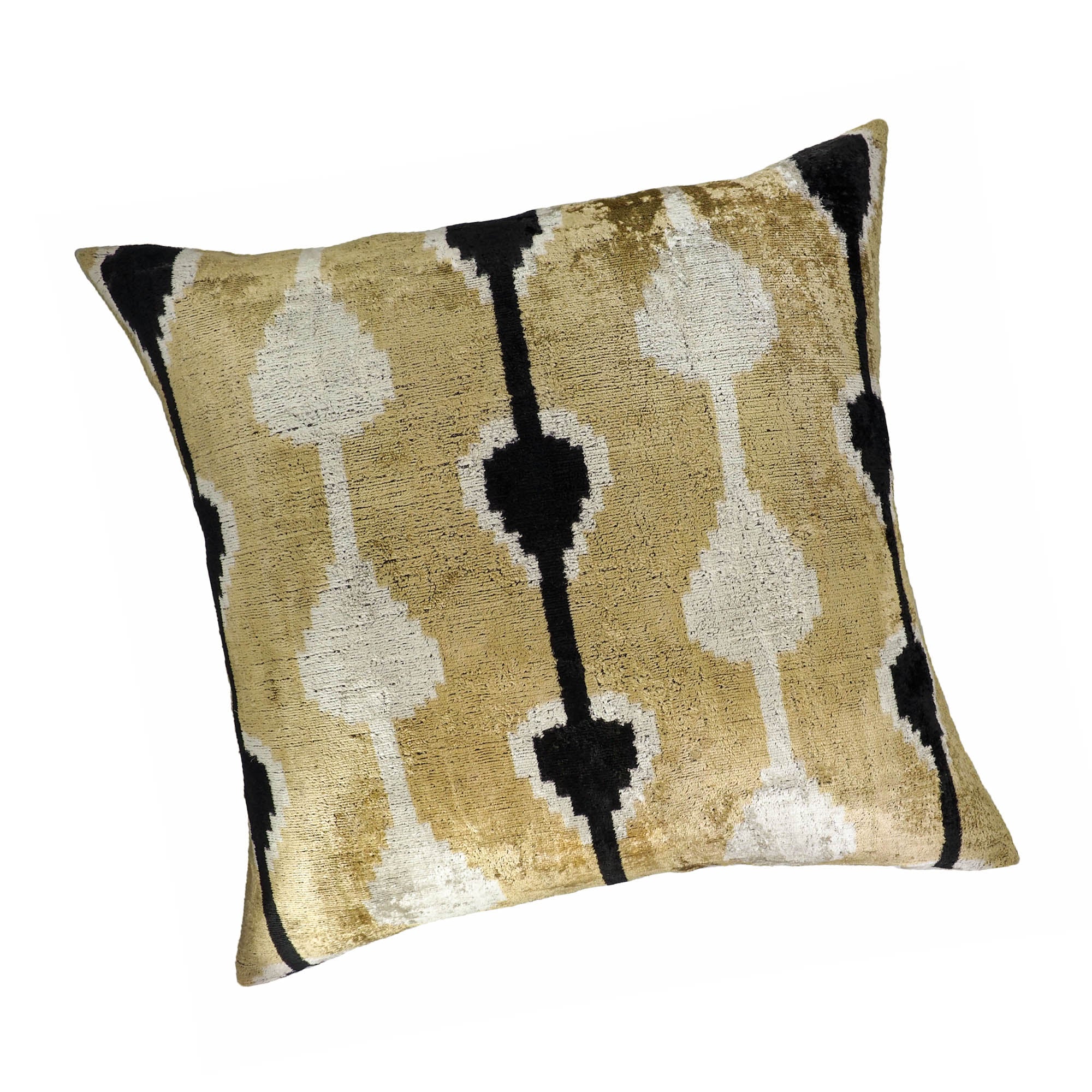 Elegant 24-inch square pillow in golden silk velvet with white and black ikat motifs.