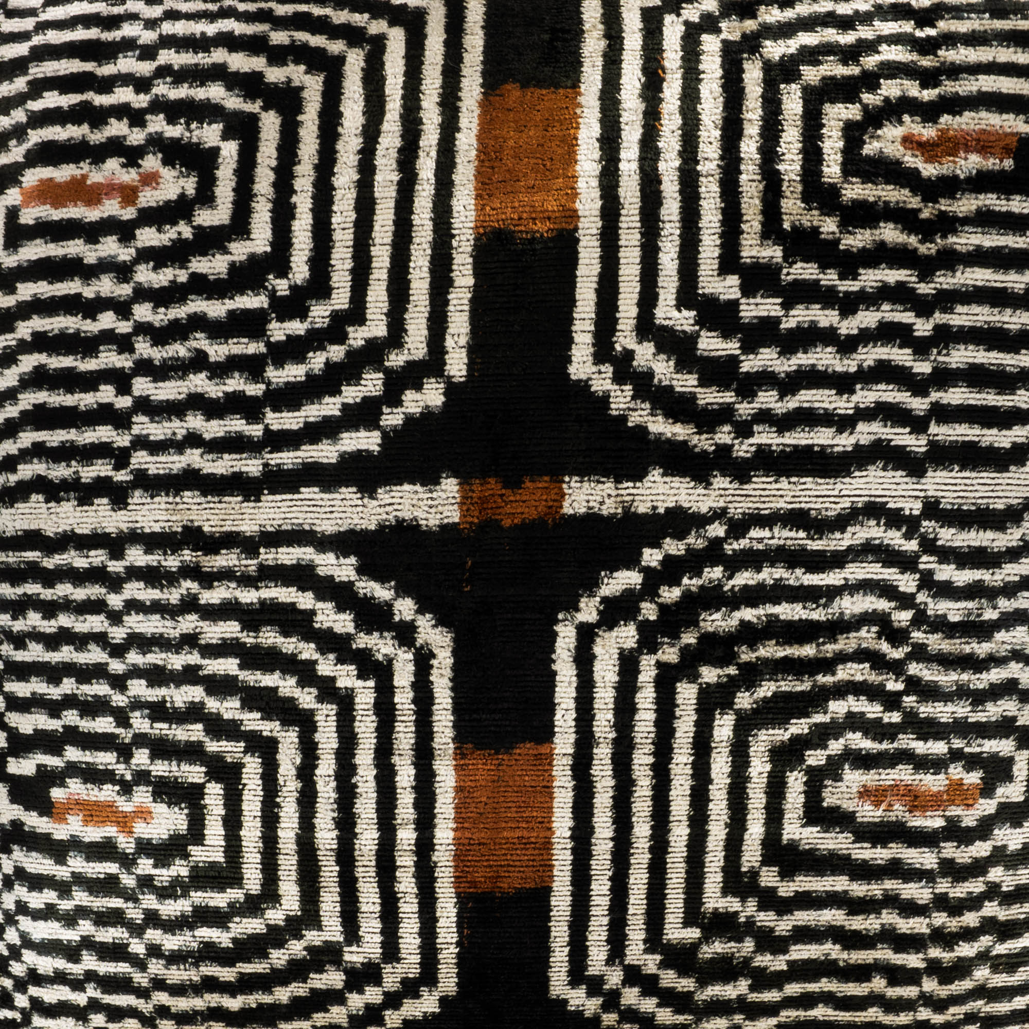close up of bold and vibrant Labyrinth Ikat pillow cover, 24" x 24", offering a tactile and visually striking decor accent.