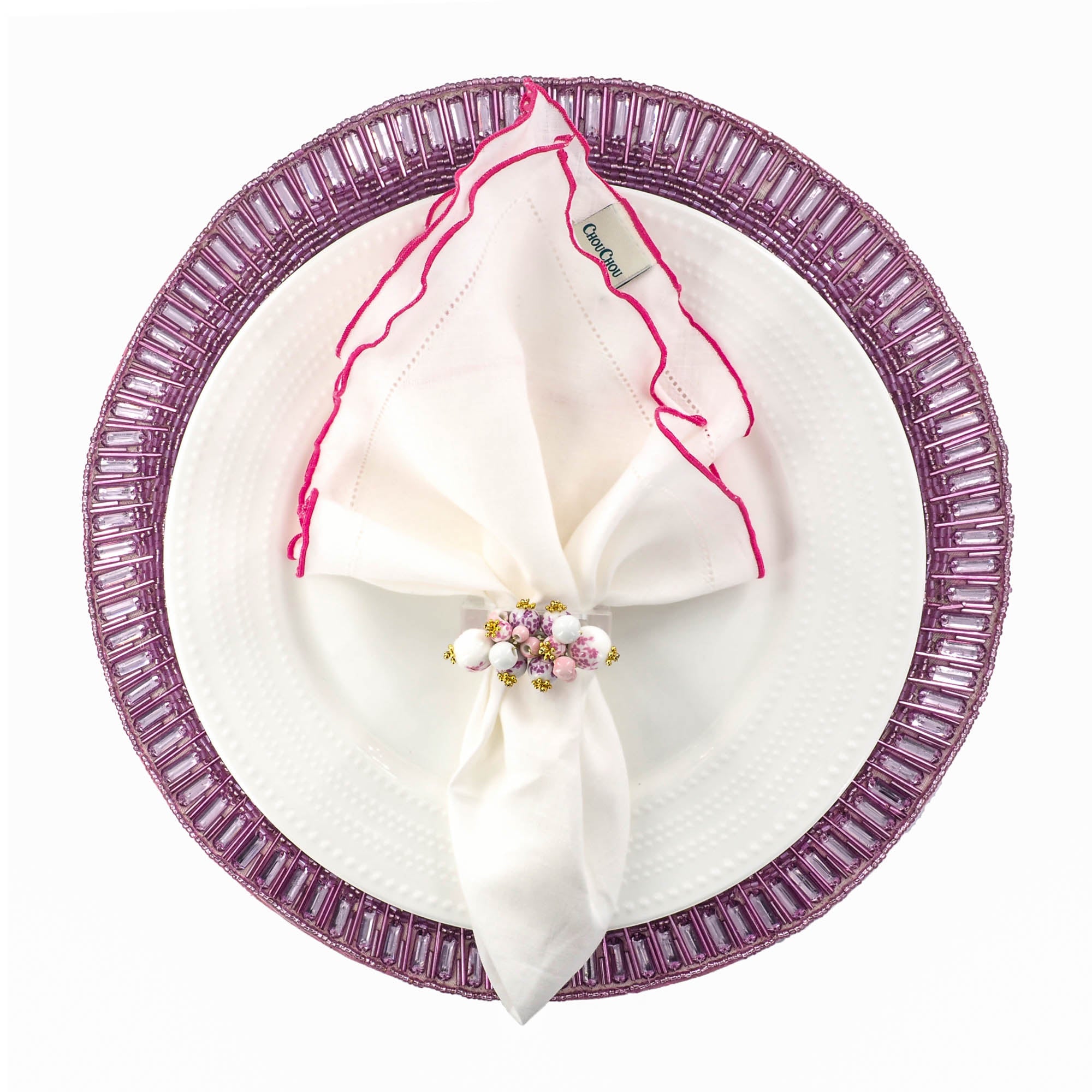 Elegant table setting featuring handmade lavender beaded placemat with white linen napkin with pink hemstitched by ChouCou Touch