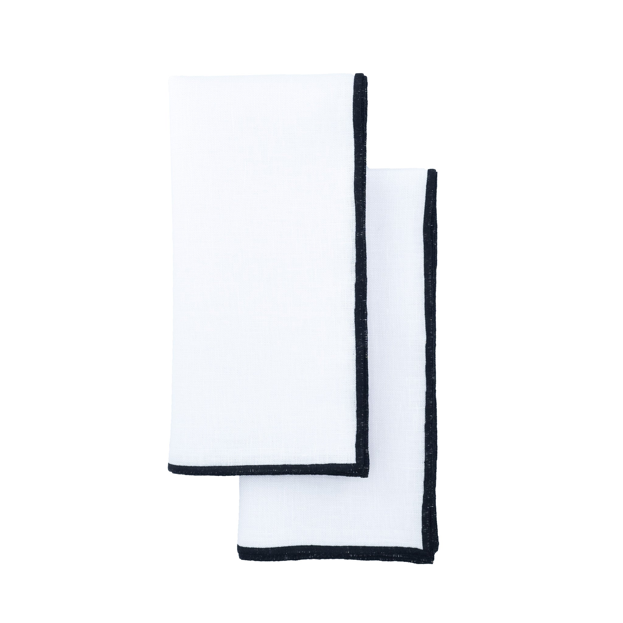 White linen napkins with black satin stitch edges, designed to bring a touch of elegance to both casual and formal settings.