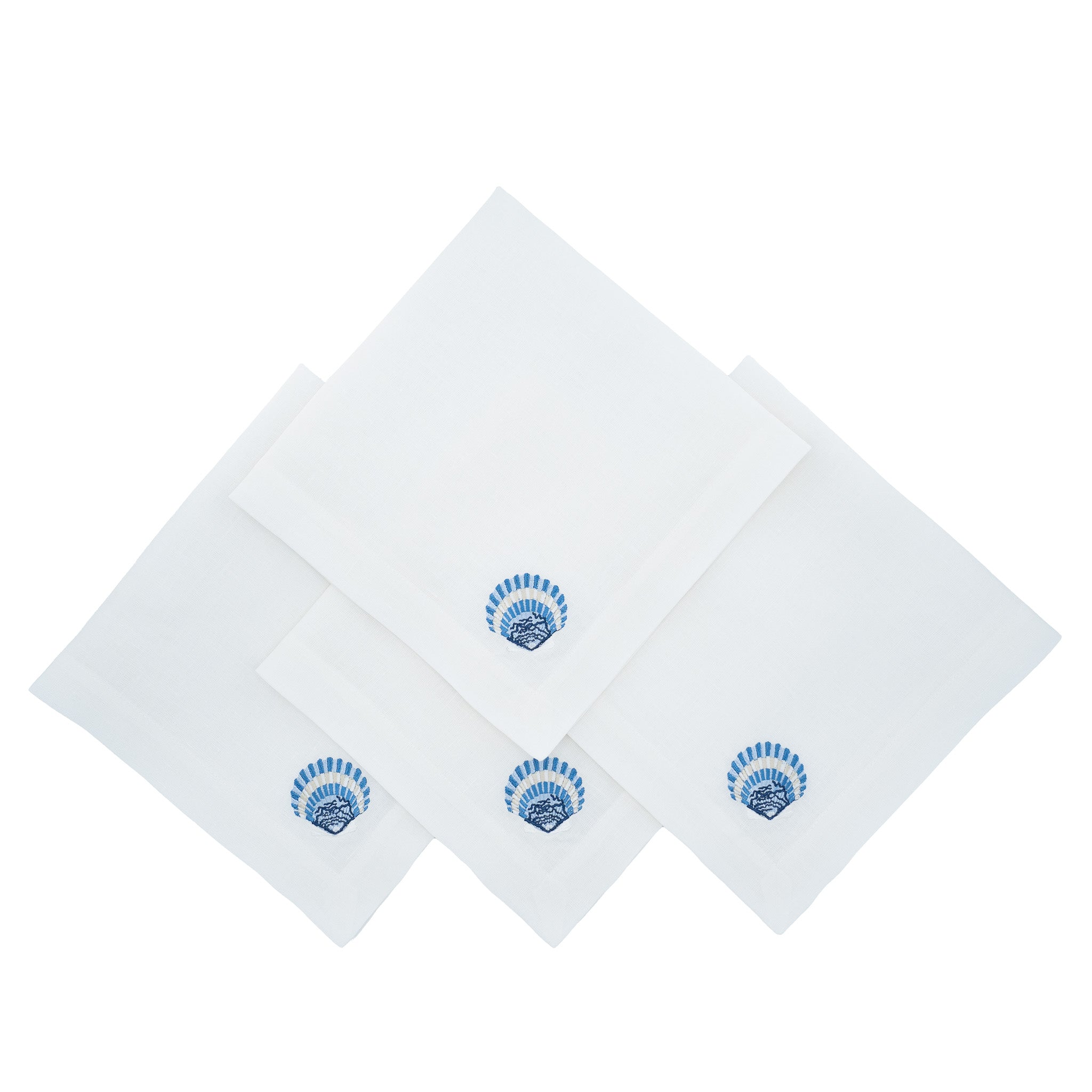Set of 4 linen napkins, 21x21 inches, with hand-embroidered blue shells for a chic and playful dining experience.