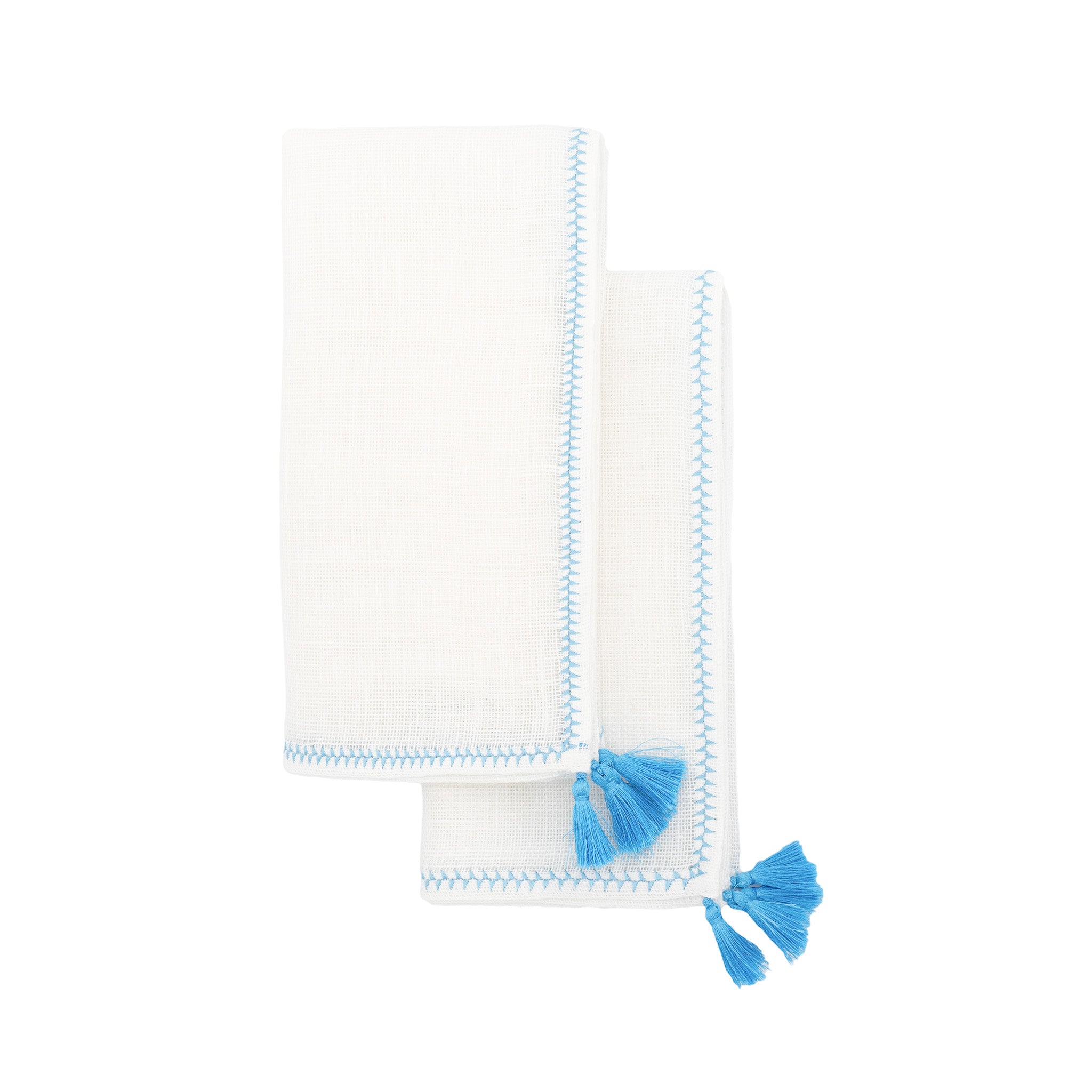 Luxurious linen napkins with blue tassels, designed to enhance your tabletops for any occasion.