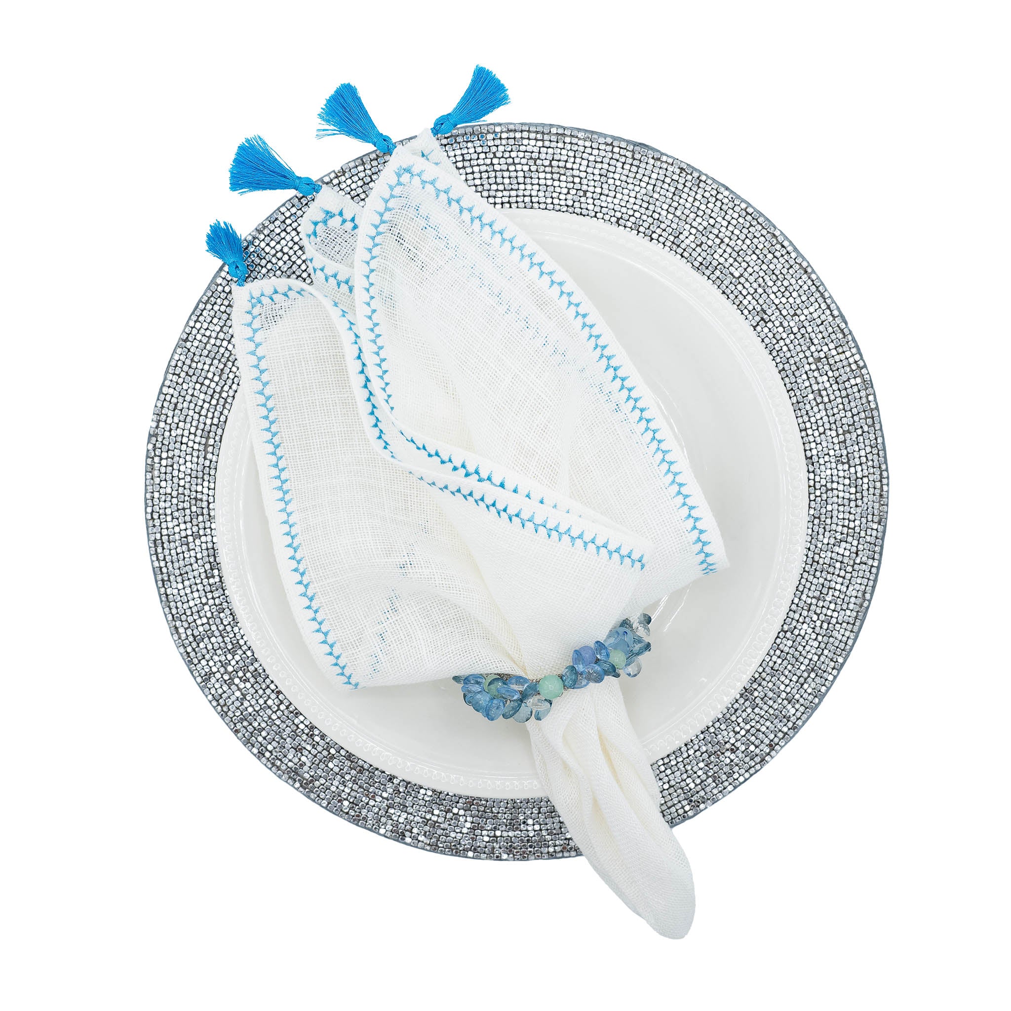 Set of 4 linen napkins, 21x21 inches, with blue tassels for a chic and elegant dining experience.