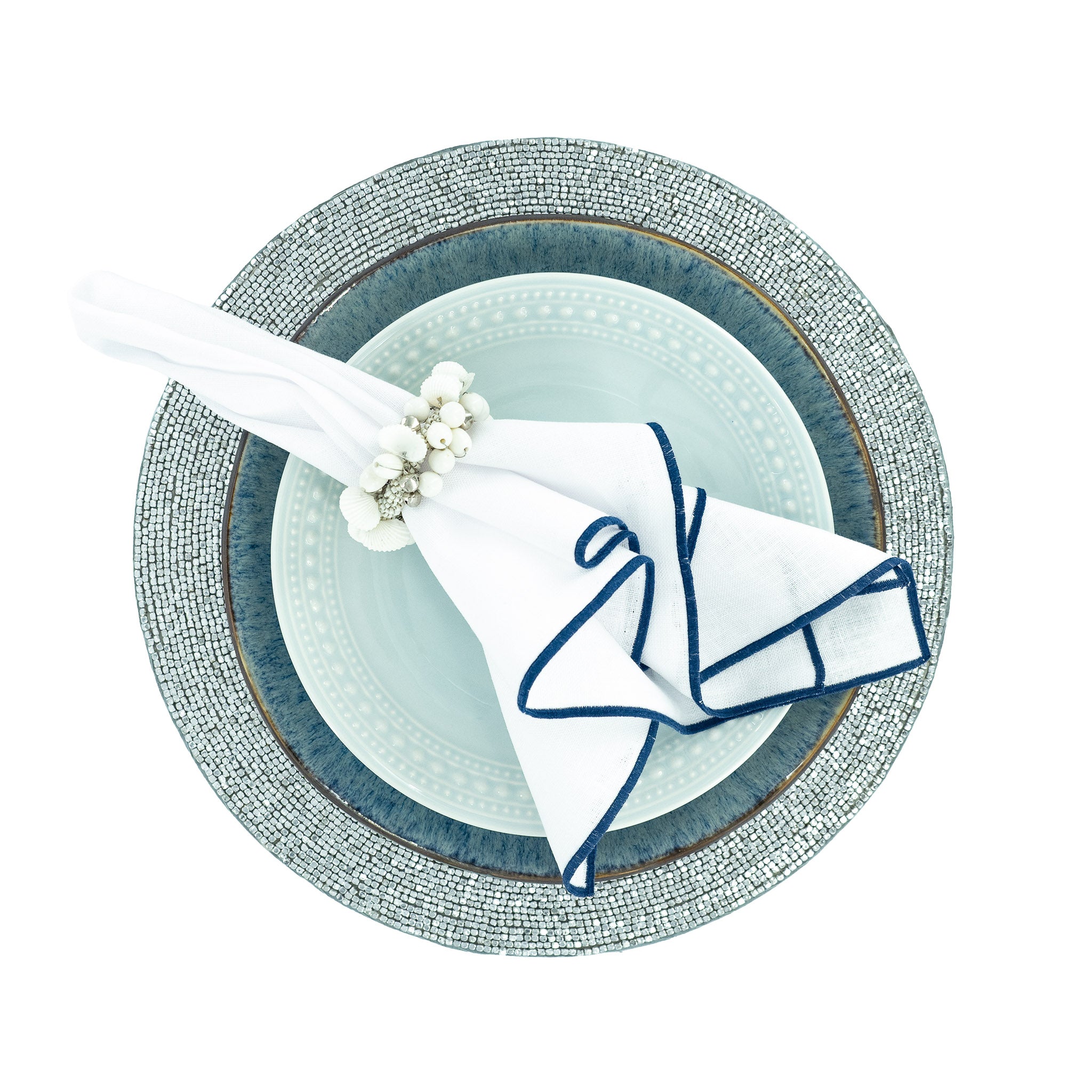 Chouchou Touch handmade linen napkins with navy stitch edges, perfect for enhancing both special occasions and everyday meals.