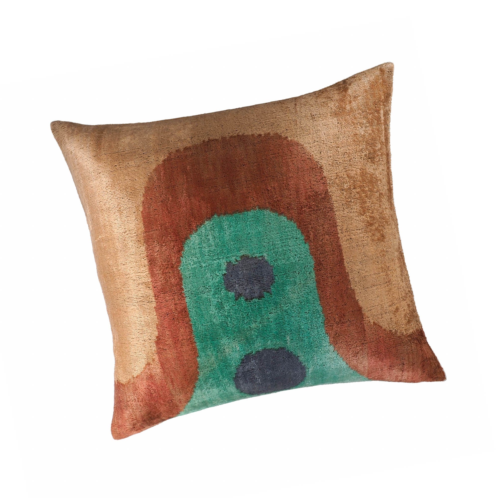 Square handmade throw pillow in brown, teal, and navy with boho-modern ikat pattern.