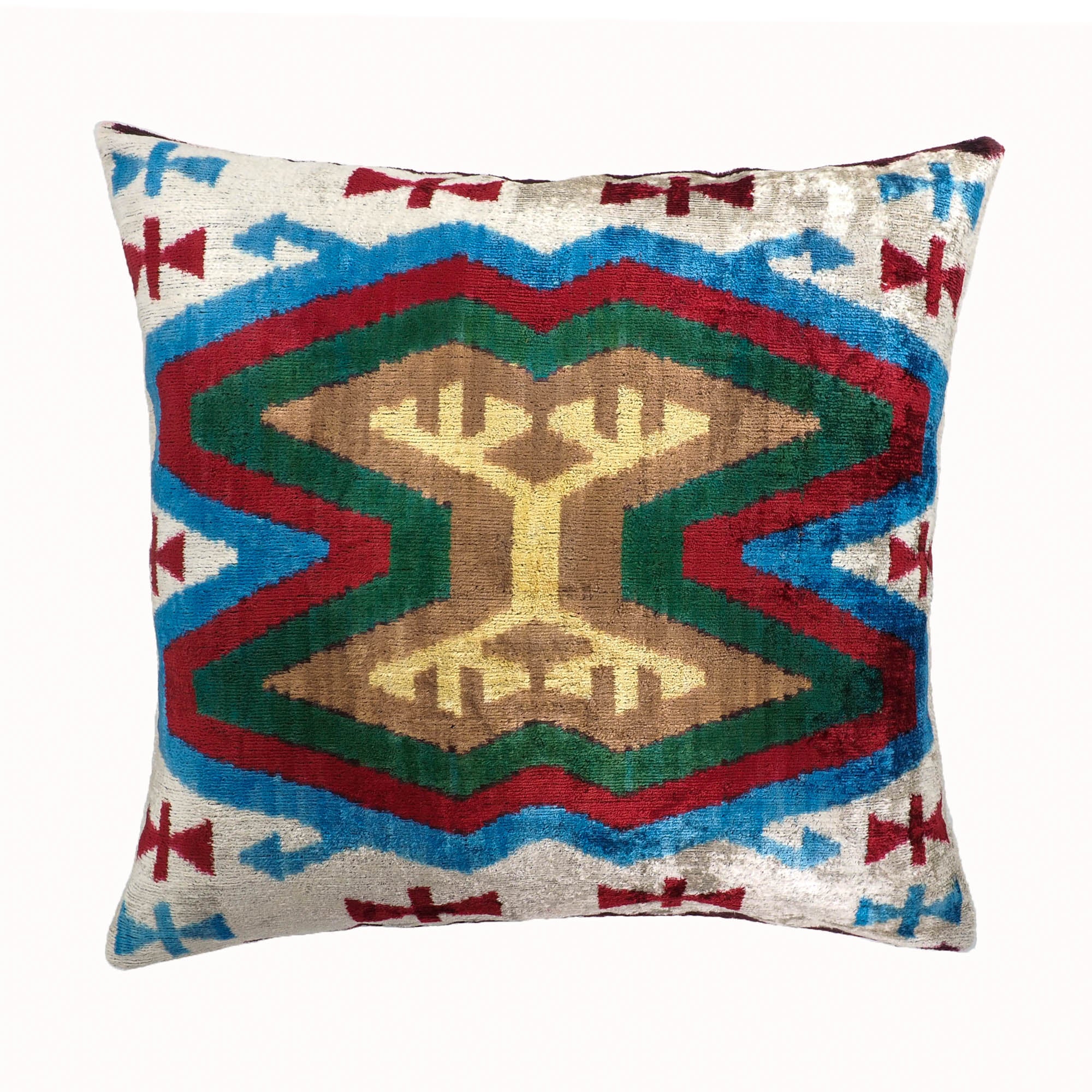 Maya silk velvet ikat throw pillow with tribal geometric design in red, green, blue, and gold.