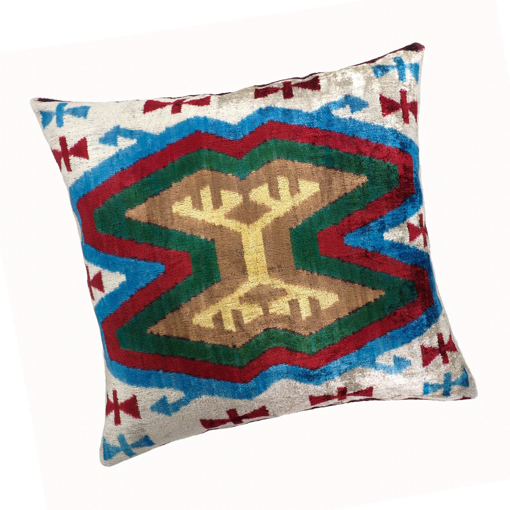 Chouchou Touch 20-inch ikat pillow cover featuring traditional motif inspired by ancient symbols.