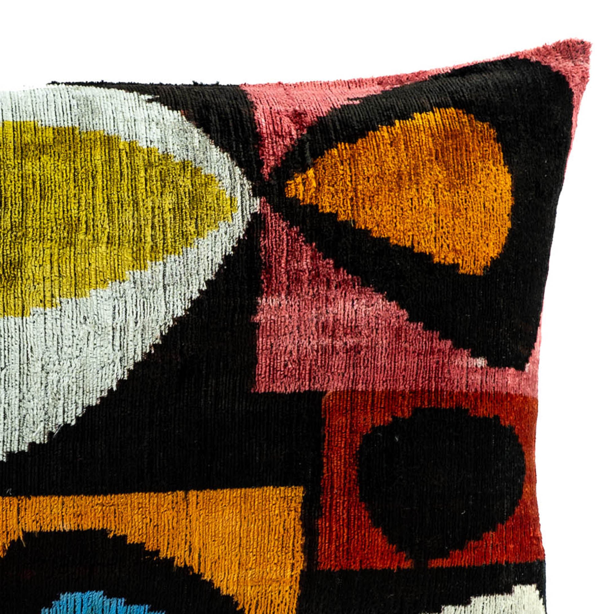 Chouchou Touch Ikat throw pillow in premium silk velvet, blending traditional craftsmanship with modern multicolored designs.