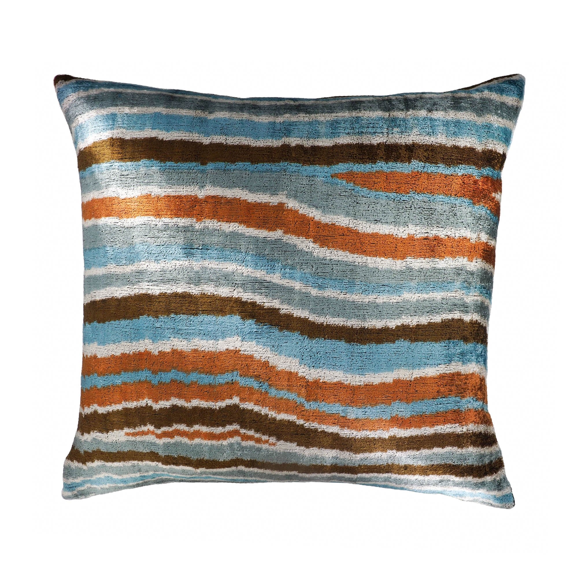 Chouchou Touch Motion pillow in silk velvet with wave-like ikat pattern in copper, blue, and brown.