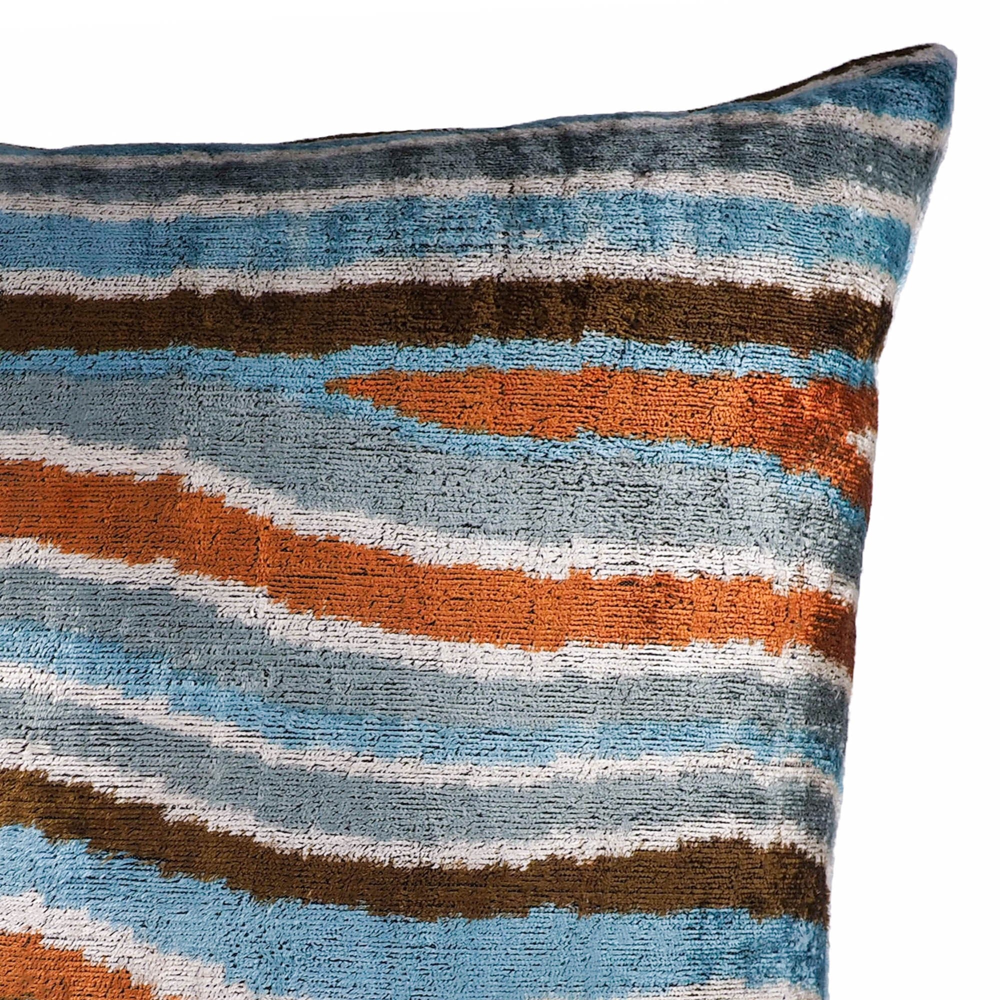 24x24 silk velvet ikat pillow featuring dynamic horizontal waves in orange, teal, and brown.