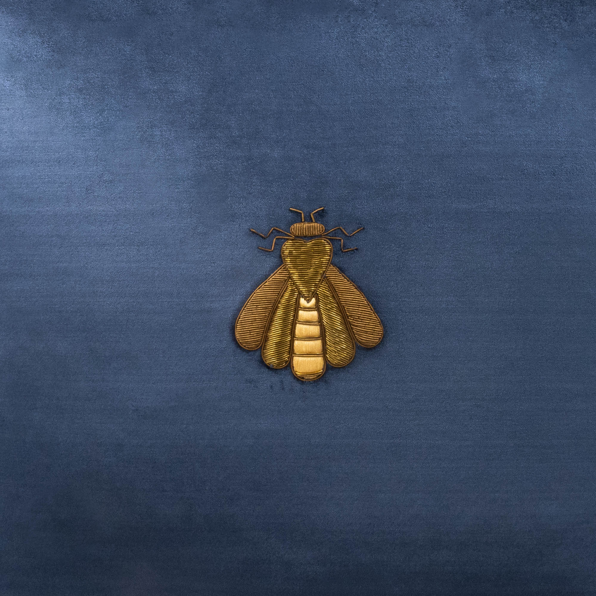 Bring luxury and sophistication into your home with handcrafted navy blue velvet pillow cover featuring regal gold bee motif in metallic thread