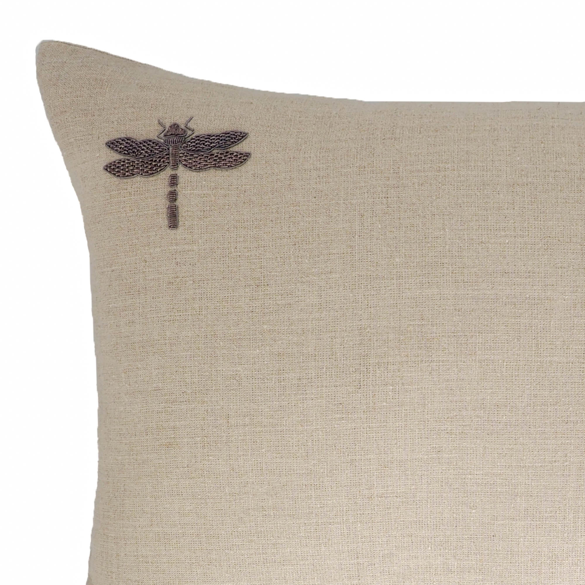 14x24 natural linen cushion with metallic dragonfly embroidery in top left corner.