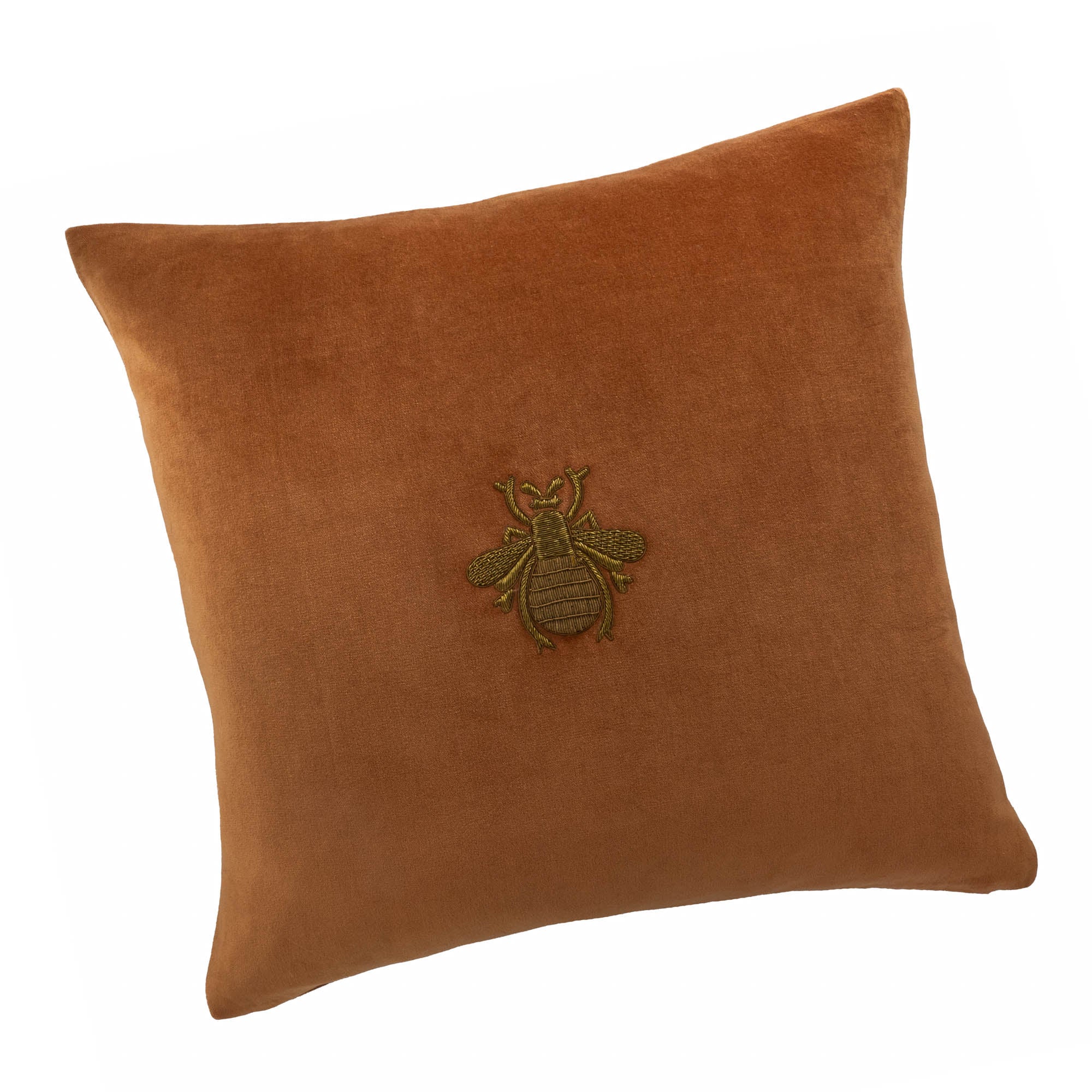 Luxury square silk velvet pillow with medieval-style bee embroidery on warm orange fabric.