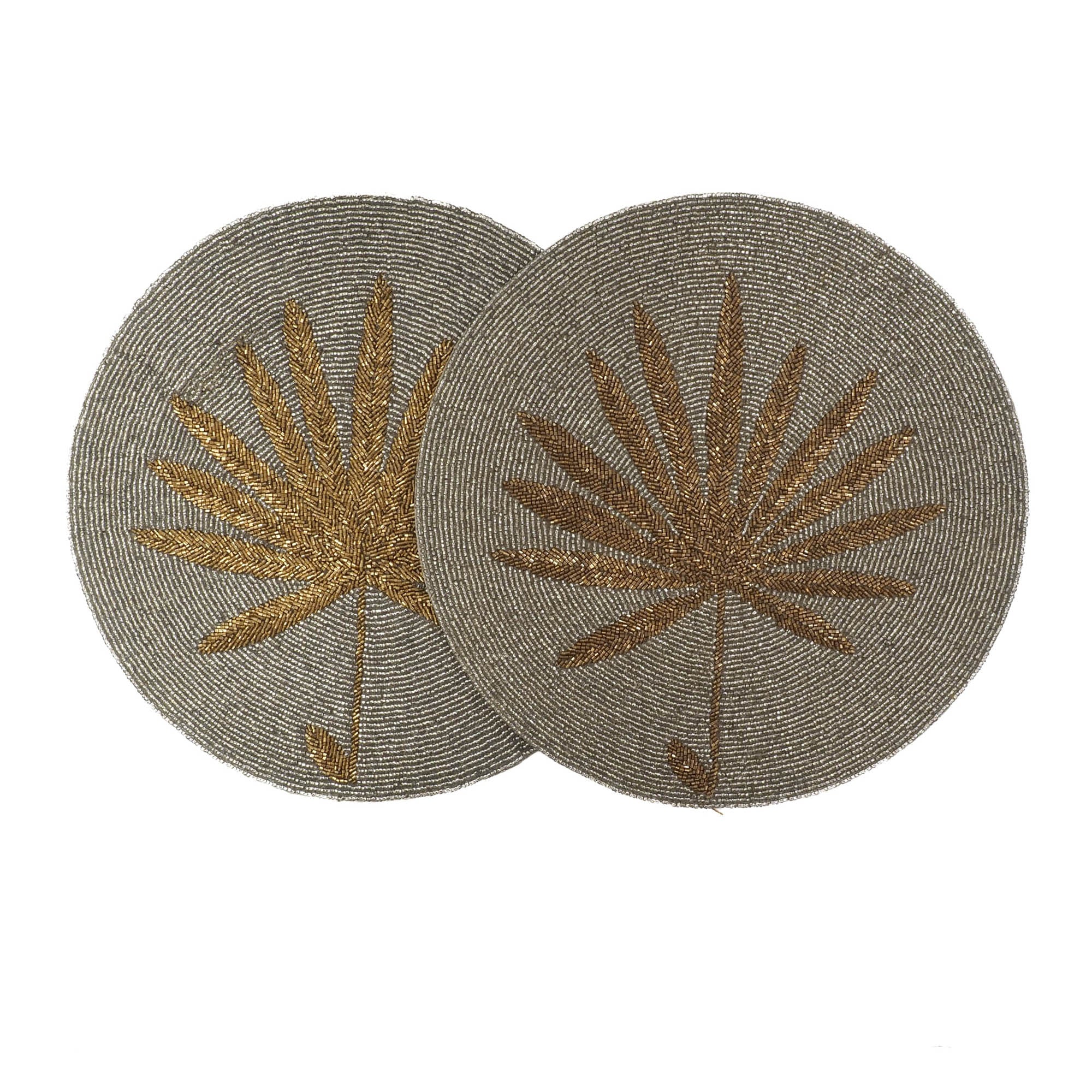 Close-up of handmade palm leaf glass beaded placemat in gold hues, showcasing coastal artistry by ChouChou Touch, set of two