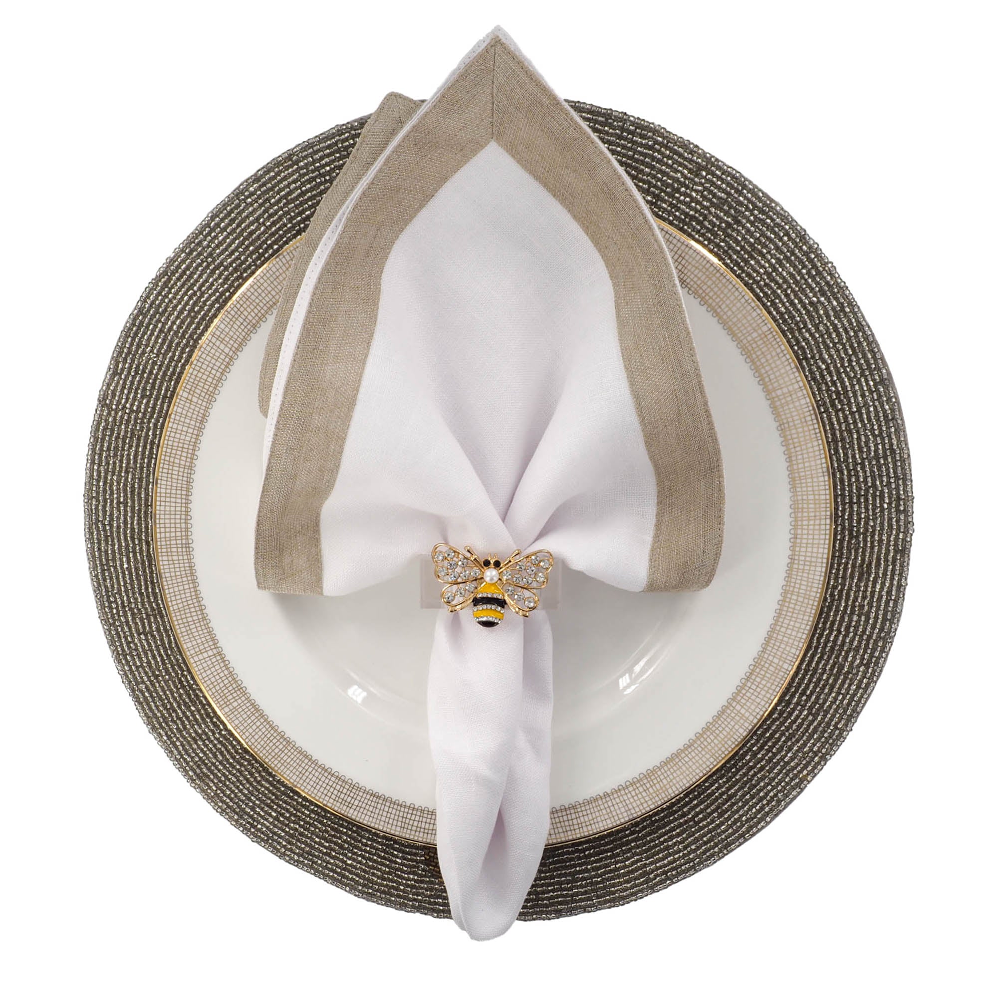 Coastal-inspired table setting featuring handmade palm leaf beaded placemat with gold and copper glass beads, styled with white linen napkin by ChouChou Touch
